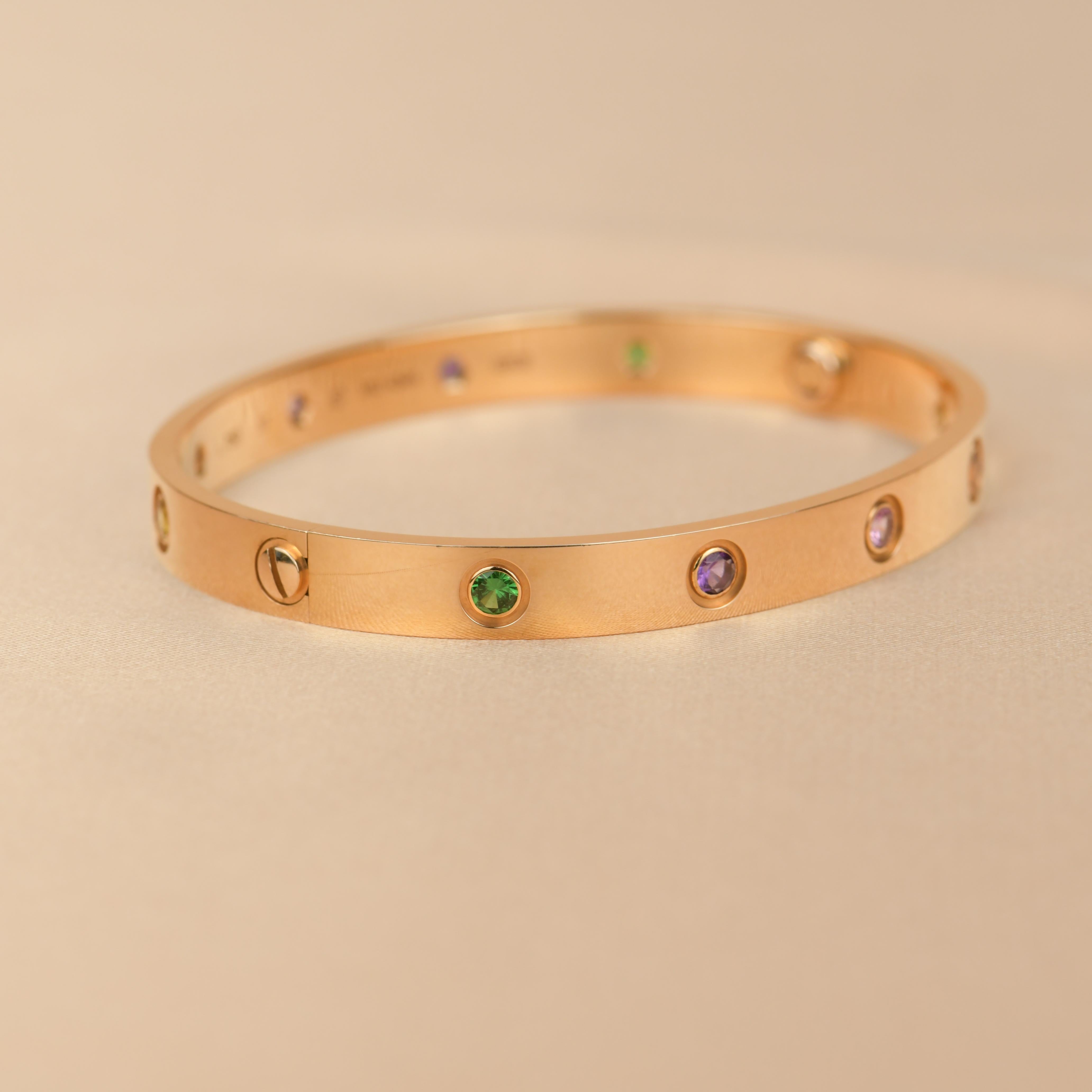 LOVE bracelet, 18K rose gold, set with 2 pink sapphires, 2 yellow sapphires, 2 green garnets, 2 orange garnets, and 2 amethysts. 
_____________________________________________________________
Dandelion Antiques Code AT-1242
Brand Cartier
Model