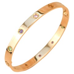 Cartier Love-Armband aus Roségold mit mehreren Edelsteinen