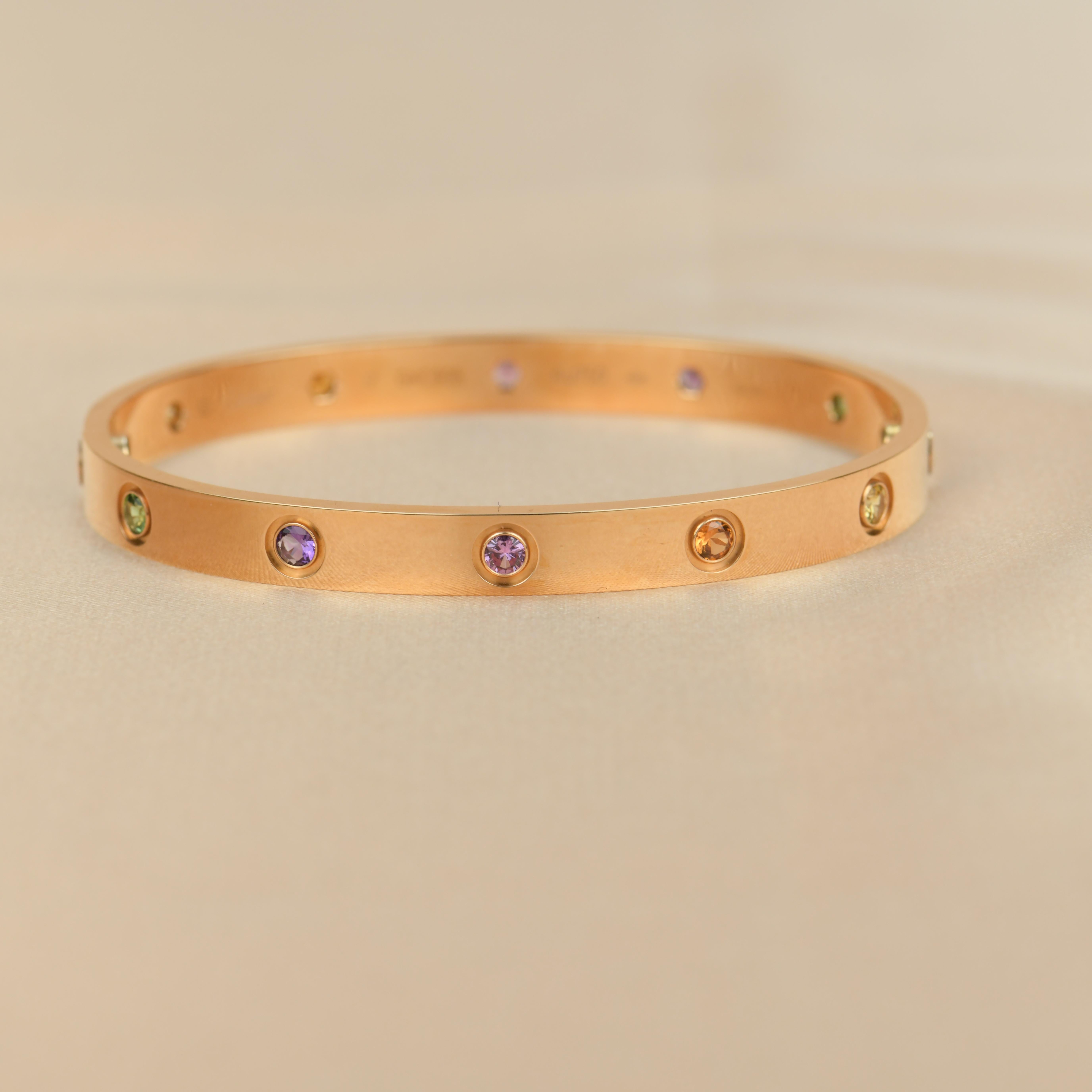 LOVE bracelet, 18K rose gold, set with 2 pink sapphires, 2 yellow sapphires, 2 green garnets, 2 orange garnets, and 2 amethysts. 
_____________________________________________________________
Dandelion Antiques Code AT-1225
Brand Cartier
Model
