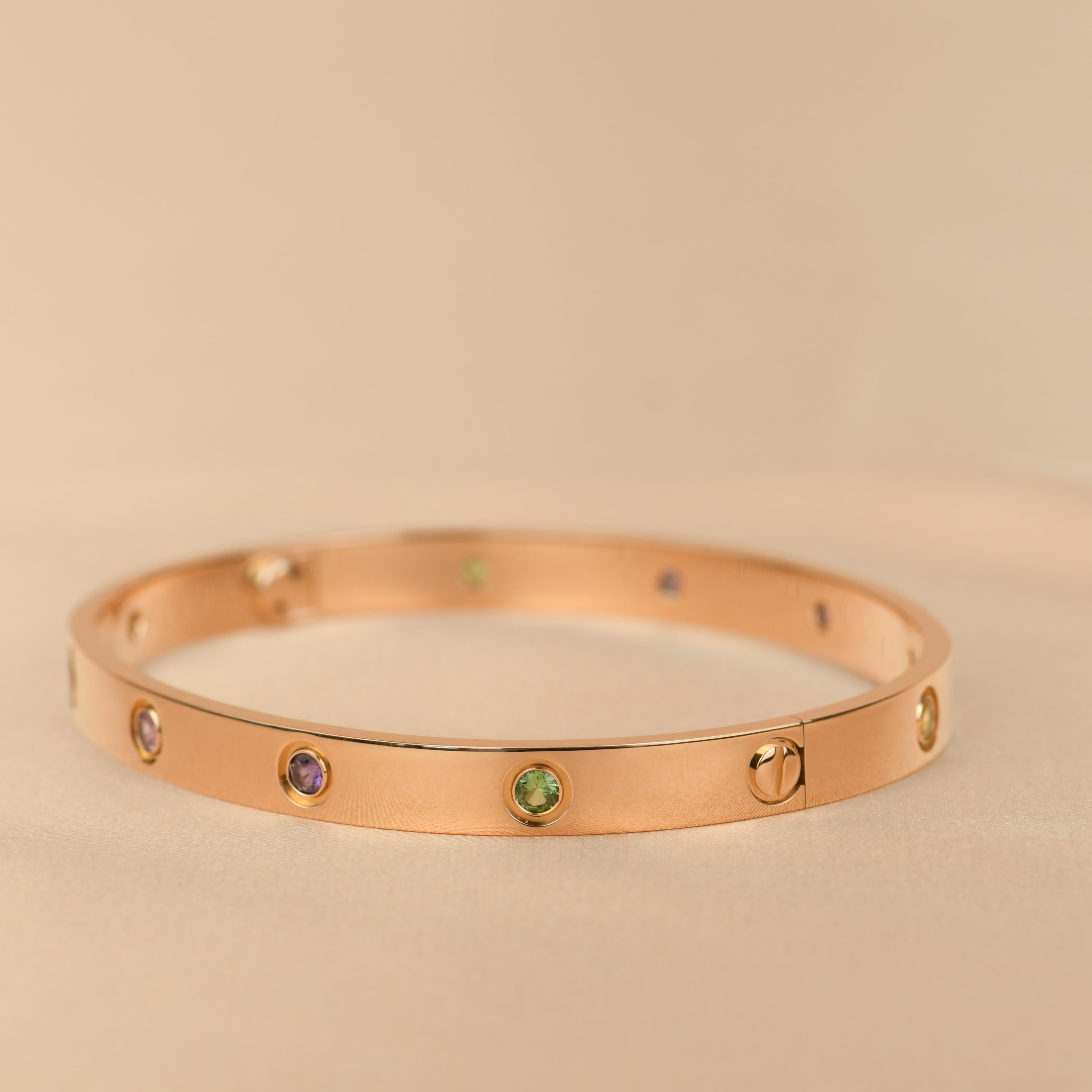 LOVE bracelet, 18K rose gold, set with 2 pink sapphires, 2 yellow sapphires, 2 green garnets, 2 orange garnets, and 2 amethysts. 
_____________________________________________________________
Dandelion Antiques Code AT-1159
Brand Cartier
Model