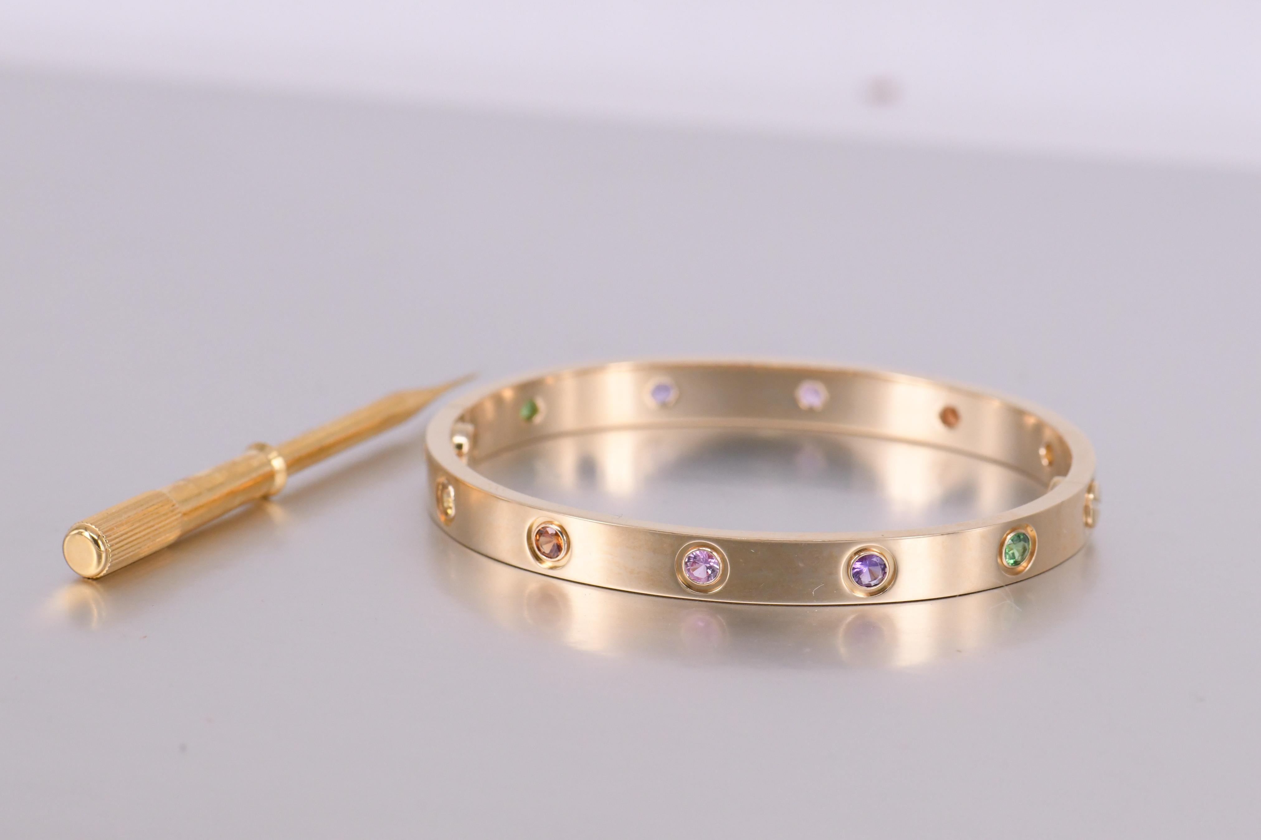 LOVE bracelet, 18K rose gold, set with 2 pink sapphires, 2 yellow sapphires, 2 green garnets, 2 orange garnets, and 2 amethysts. Comes with a screwdriver and Box.  Size 16 

__________________________________

Dandelion Antiques Code	AT-0690
Brand	 