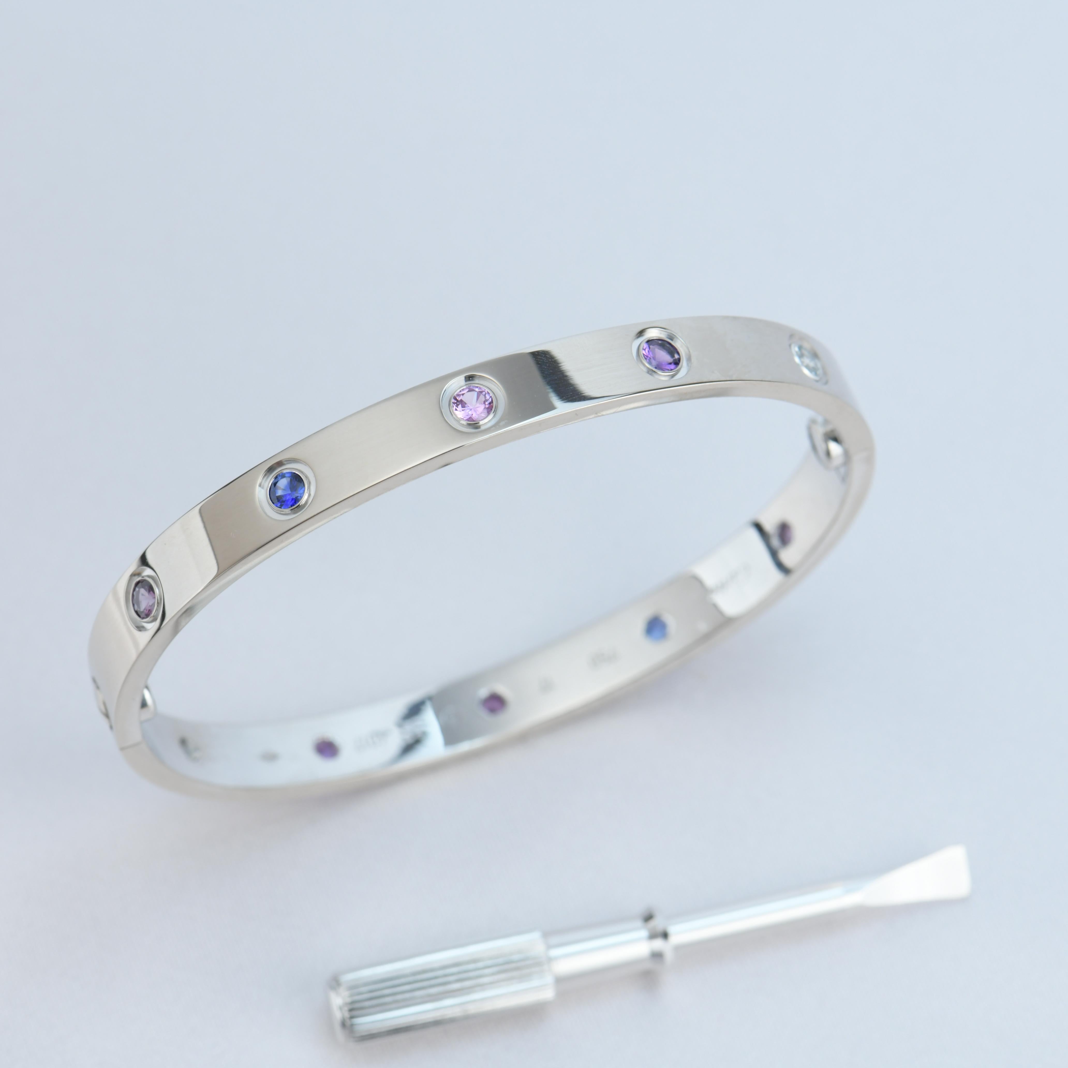 LOVE bracelet, 18K white gold, set with 2 aquamarines, 2 pink sapphires, 2 blue sapphires, 2 purple spinels, and 2 amethysts. Size 16
__________________________________

Dandelion Antiques Code AT-0917
Brand Cartier
Model B6036317
Date Circa