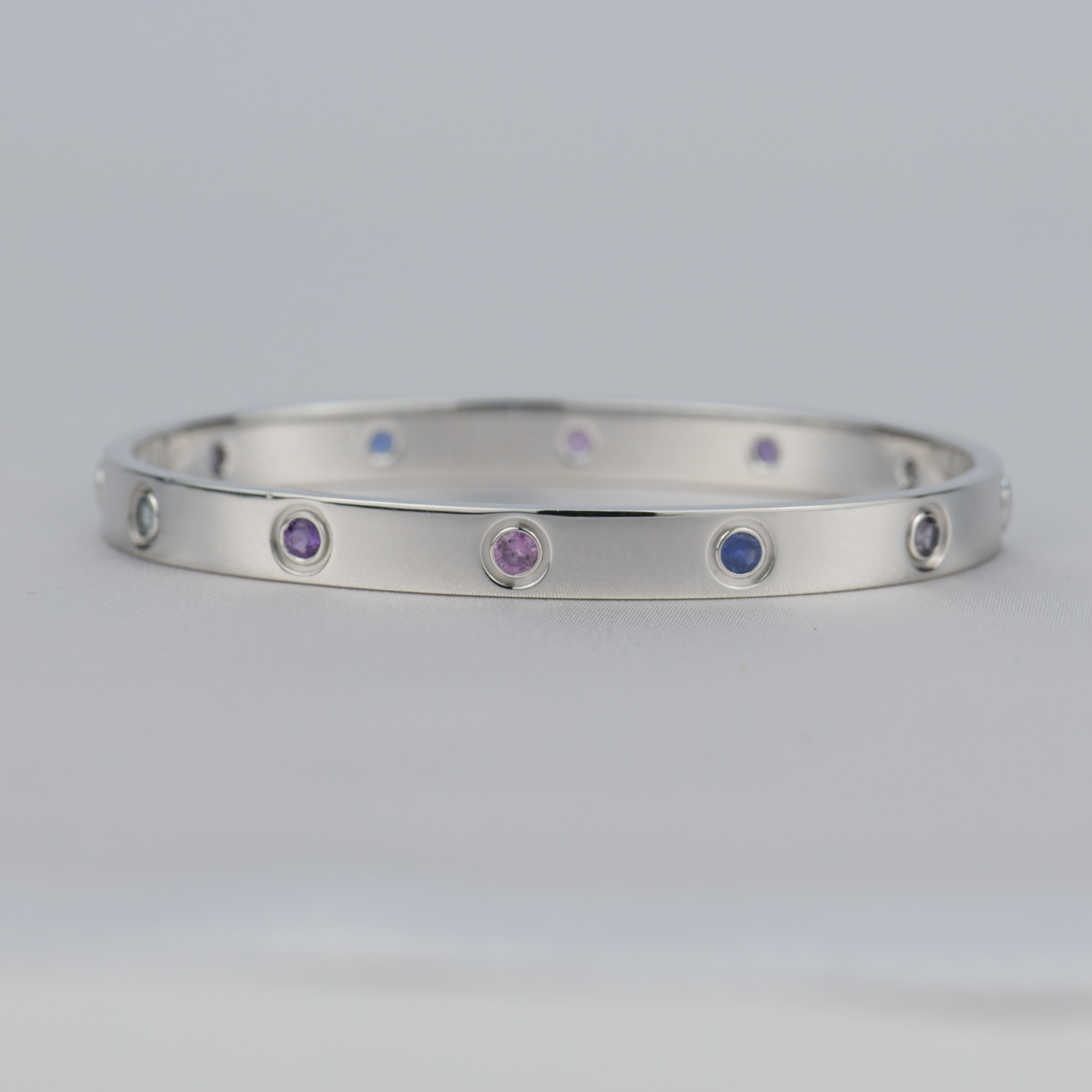 LOVE bracelet, 18K white gold, set with 2 aquamarines, 2 pink sapphires, 2 blue sapphires, 2 purple spinels, and 2 amethysts. Size 17

__________________________________

Dandelion Antiques Code AT-0778
Brand Cartier
Model B6036317
Date 2013
Retail
