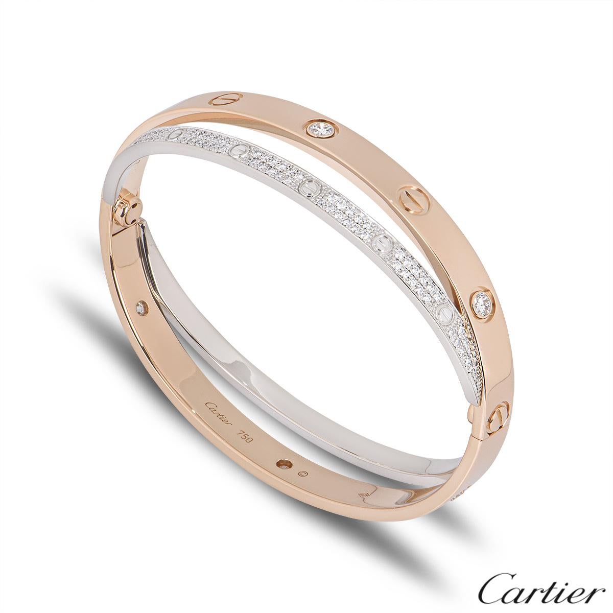 A double Cartier 18k rose and white gold Love bangle. The rose gold bangle is set with 6 round brilliant cut diamonds and alternating screw motifs, interlinking with it is a fully diamond paved 18k white gold band on either side also displaying the