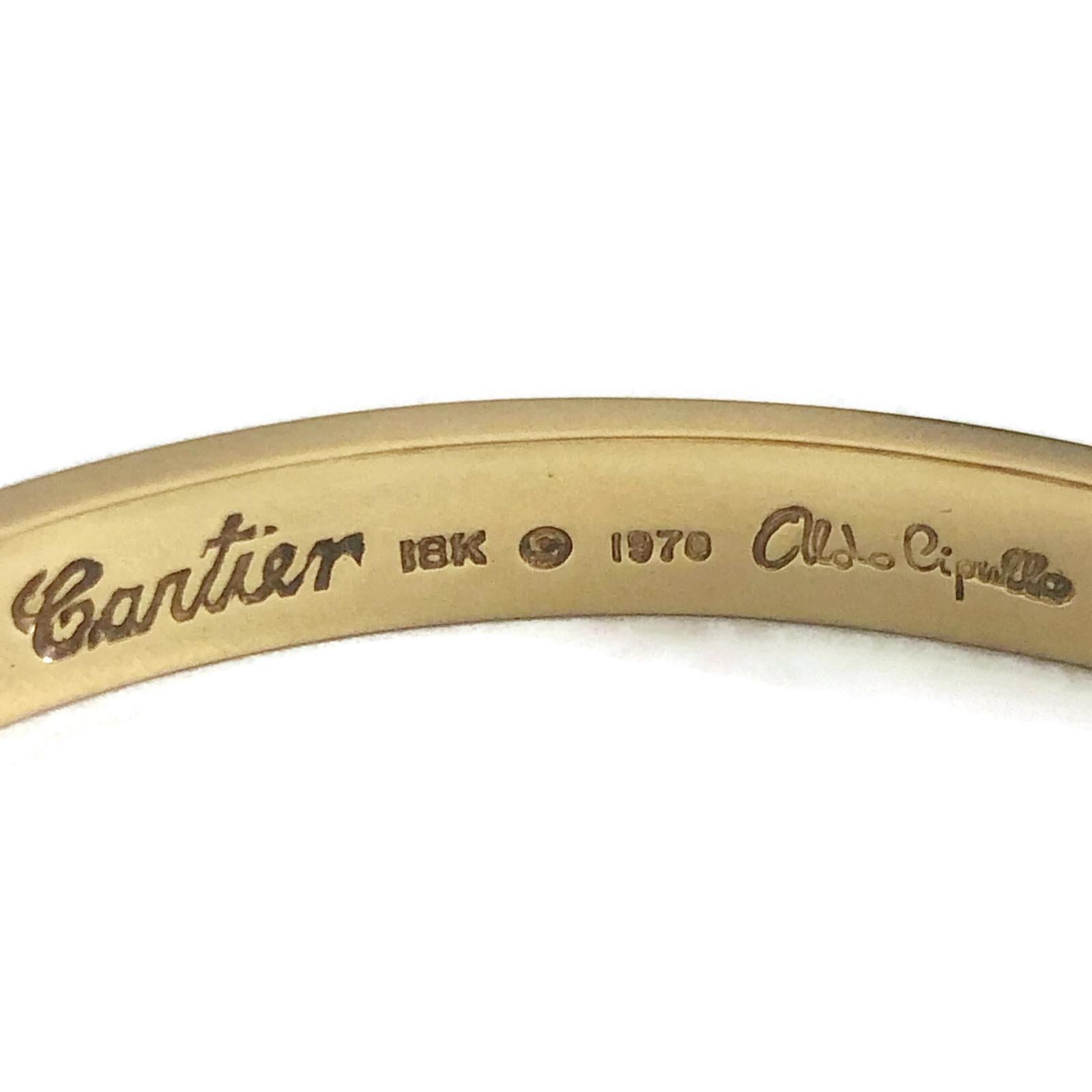 Cartier Love Bracelet signed by the designer, Aldo Cipullo in 18k yellow gold.  This bracelet was never professionally polished so comes to you with all its gold intact.  It was cleaned gently with soap and water and polished with a soft cloth.

Of