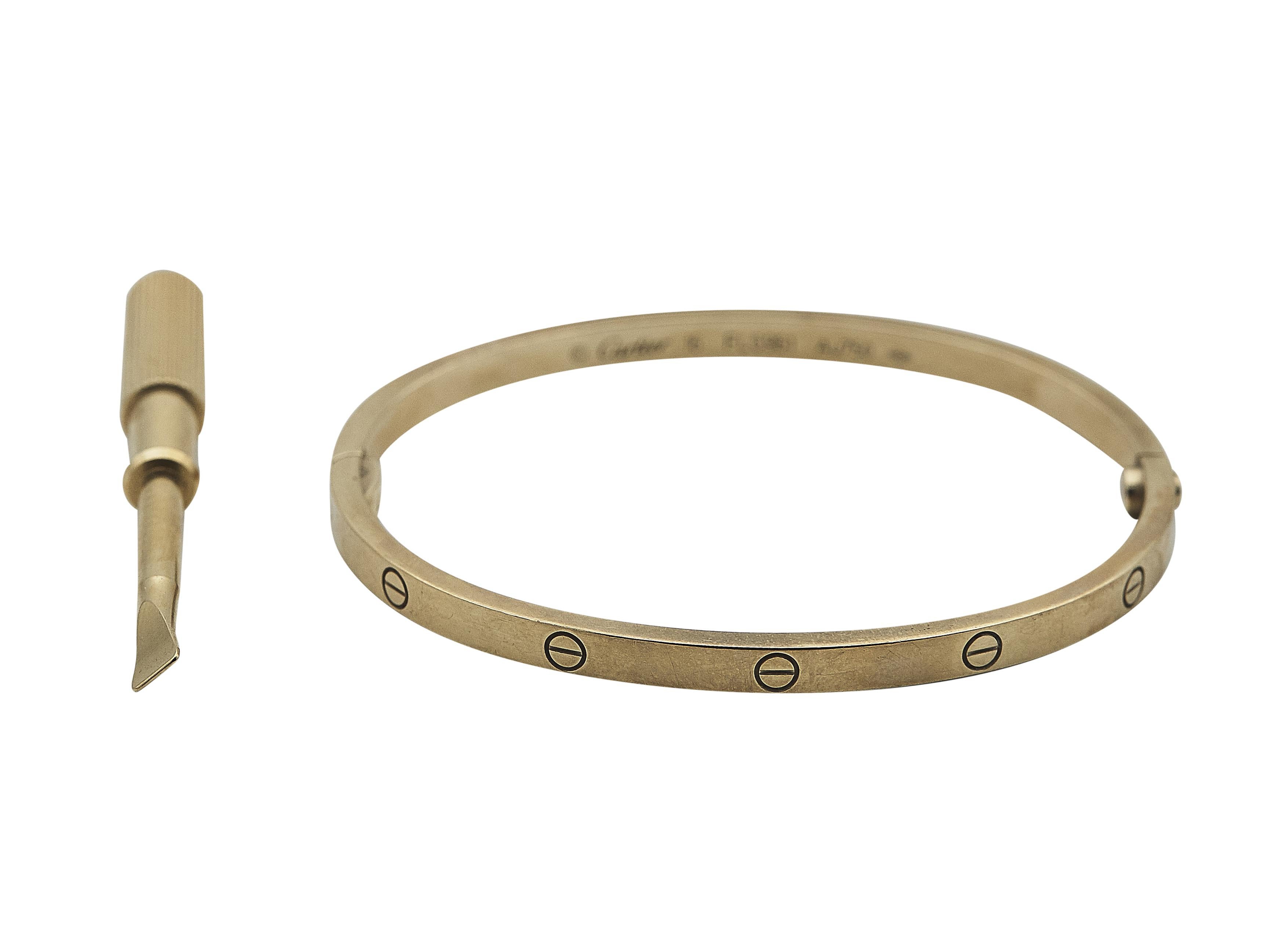 The bracelet: A Cartier Love bangle bracelet fitted with a single-screw closure. This Small model is designed in eighteen karat yellow gold and is a size 16.

The bracelet is in good condition. There is moderate wear throughout, including a few