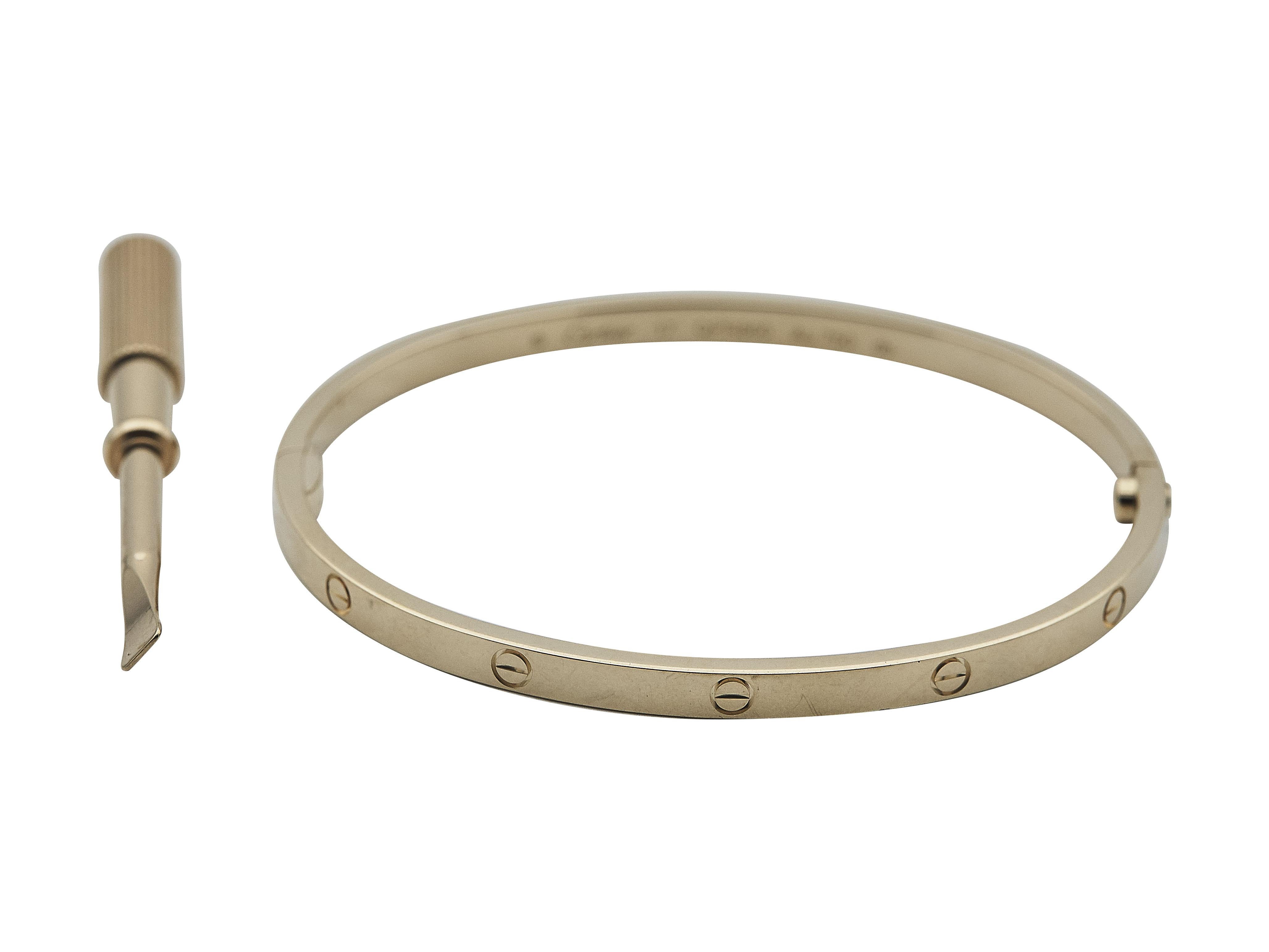 The bracelet: A Cartier Love bangle bracelet with single-screw closure. This eighteen karat yellow gold small model is a size 17.

The bracelet is in excellent condition, with only a few minor scratches that are expected with normal wear. The brand