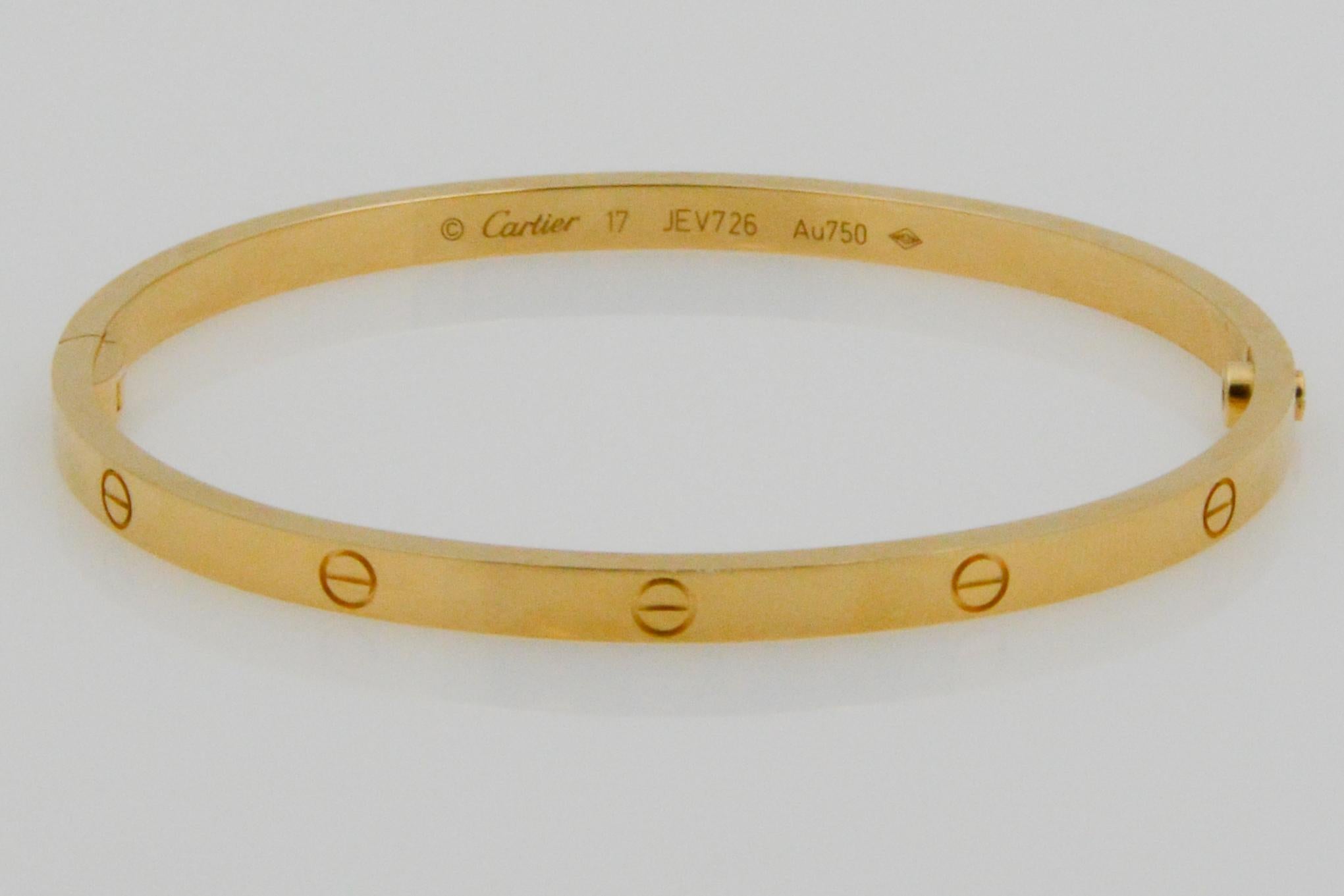 From Cartier, comes the signature Love bracelet in a small 18k yellow gold model. The bracelet is sold with the box and screwdriver
