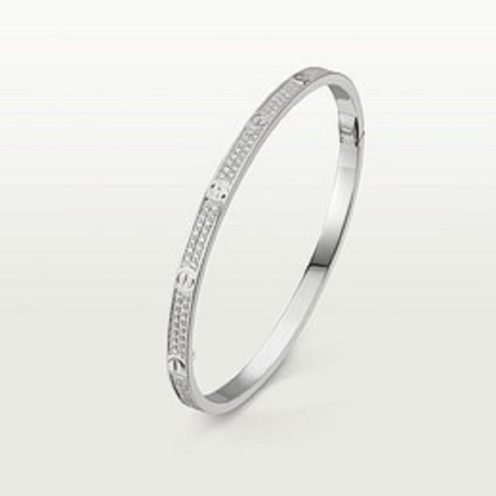 LOVE bracelet, small model, white gold 750/1000, set with 177 brilliant-cut diamonds totalling 0.95 carats. Supplied with a screwdriver. Width: 3.65 mm (for size 17). Now available in a slimmer version, Cartier continues to write the story of the