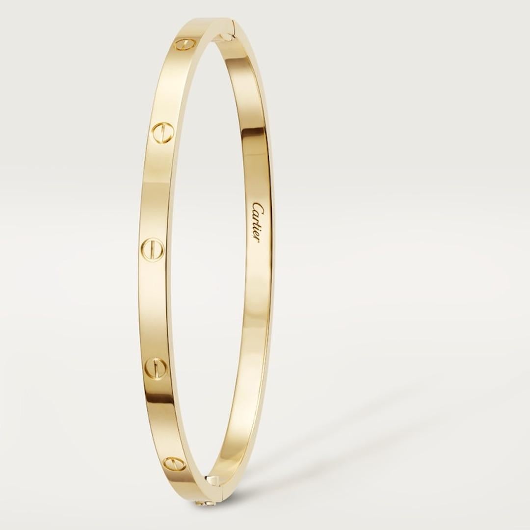 Beautiful Cartier love bracelet in the newer thin small model.  The width of this bracelet is 3.65 mm. The bracelet is the yellow gold model and is a size 16. The bracelet is fully hallmarked with makers mark and serial numbers and is in excellent