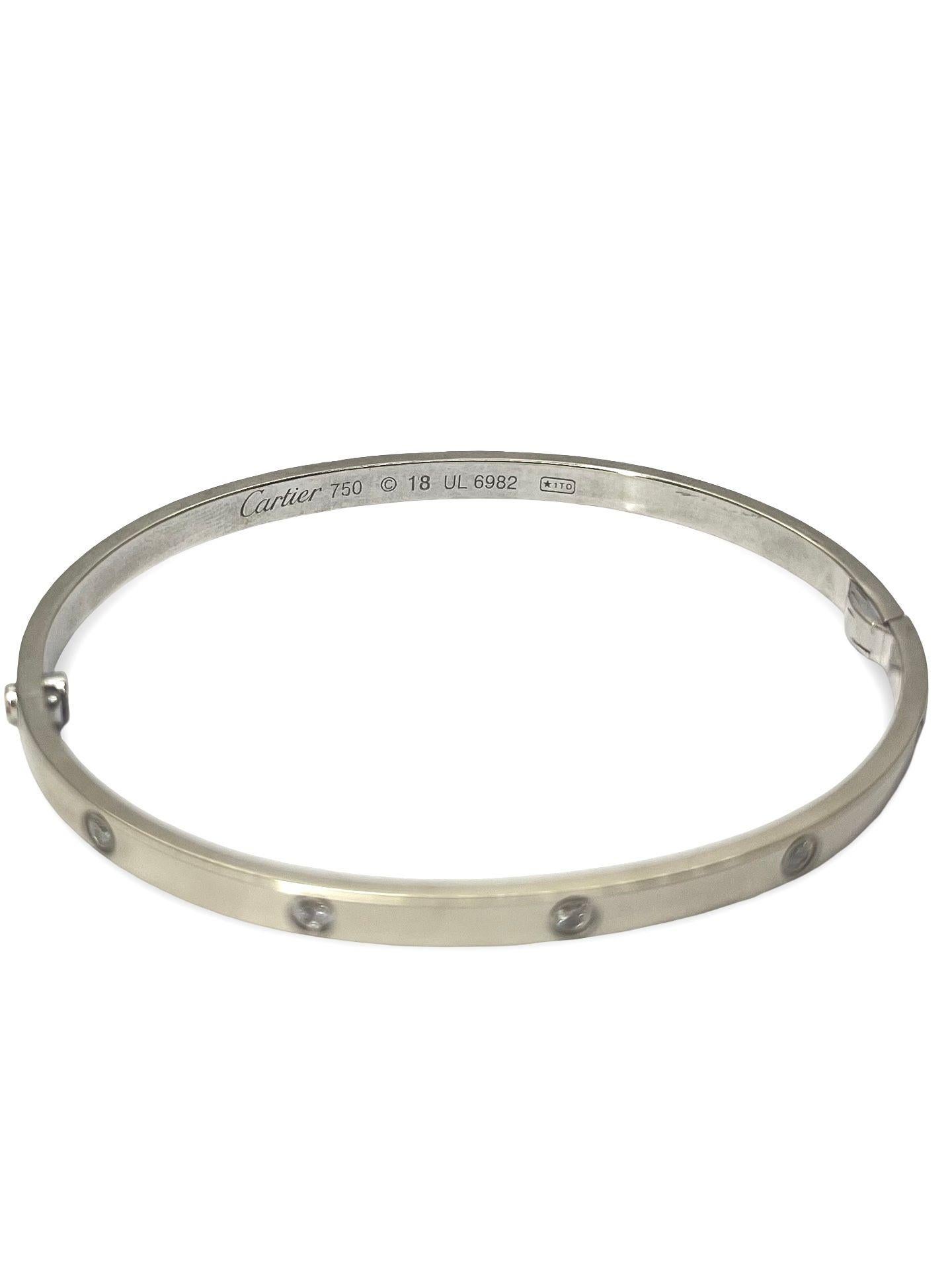 Discover the iconic elegance of the Love bracelet, small model, by Cartier, crafted in 18K white gold (750/1000). This exquisite piece is set with 10 natural diamonds, each expertly cut to enhance their brilliance and add a refined sparkle. Signed,