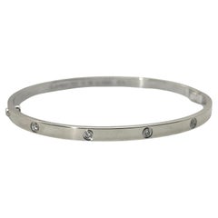 Bracelet Love de Cartier petit modèle en or blanc avec 10 diamants