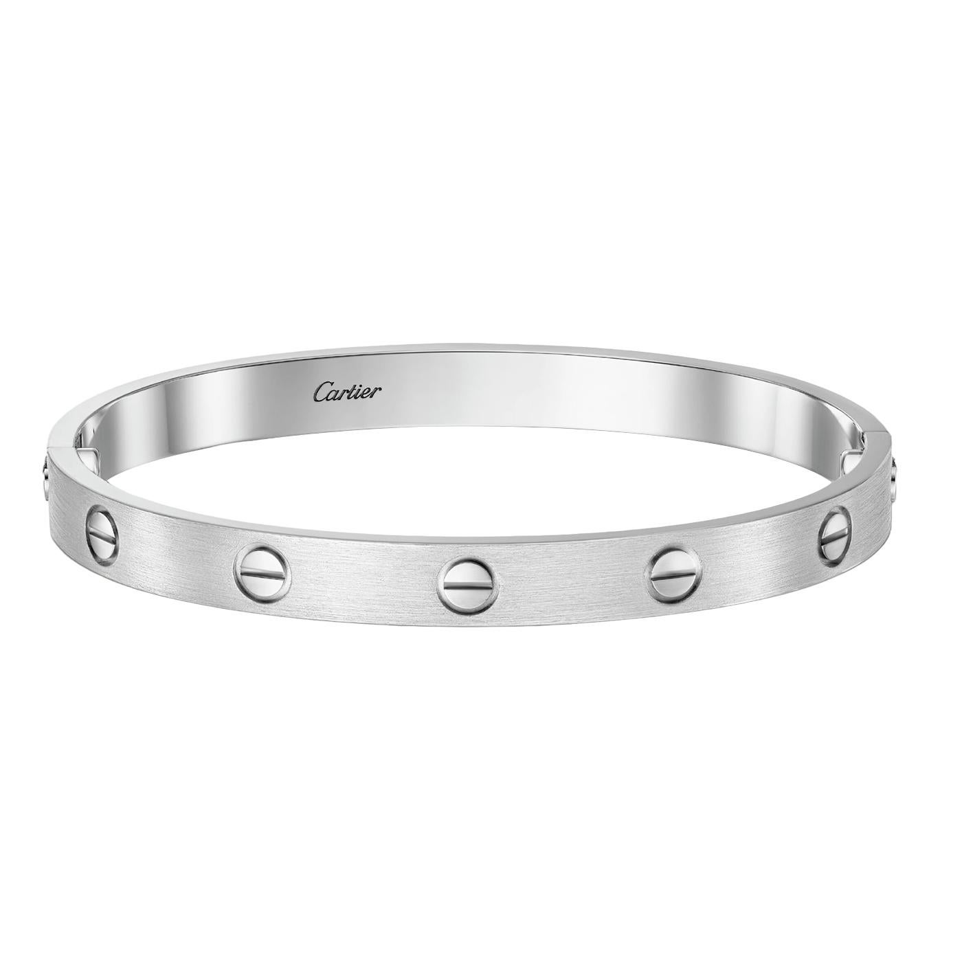 LOVE bracelet, white gold 750/1000, brushed finish. Comes with a screwdriver. Width: 6.1 mm. Created in New York in 1969, the LOVE bracelet is a jewelry design icon: a close-fitting, oval bracelet composed of two rigid arcs, which is worn on the