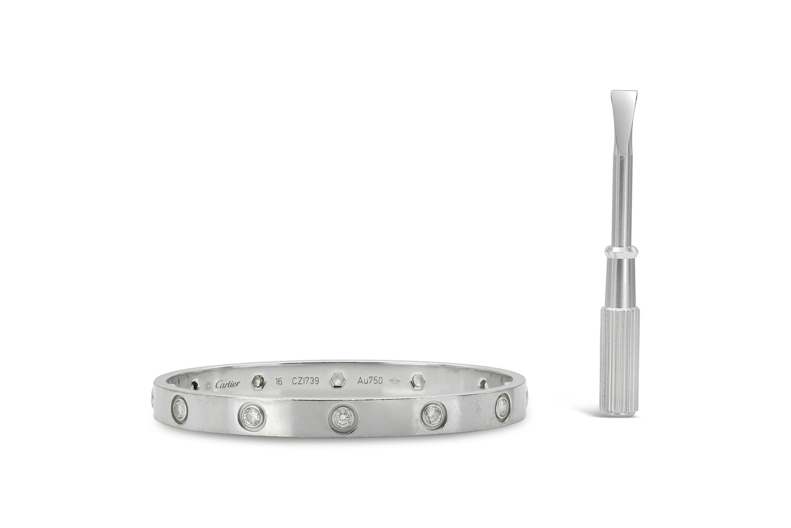 Finely crafted in 18k white gold with 10 Round Brilliant cut Diamonds.
Signed by Cartier
Size 16
Comes with its Certificate of Authenticity and screw.