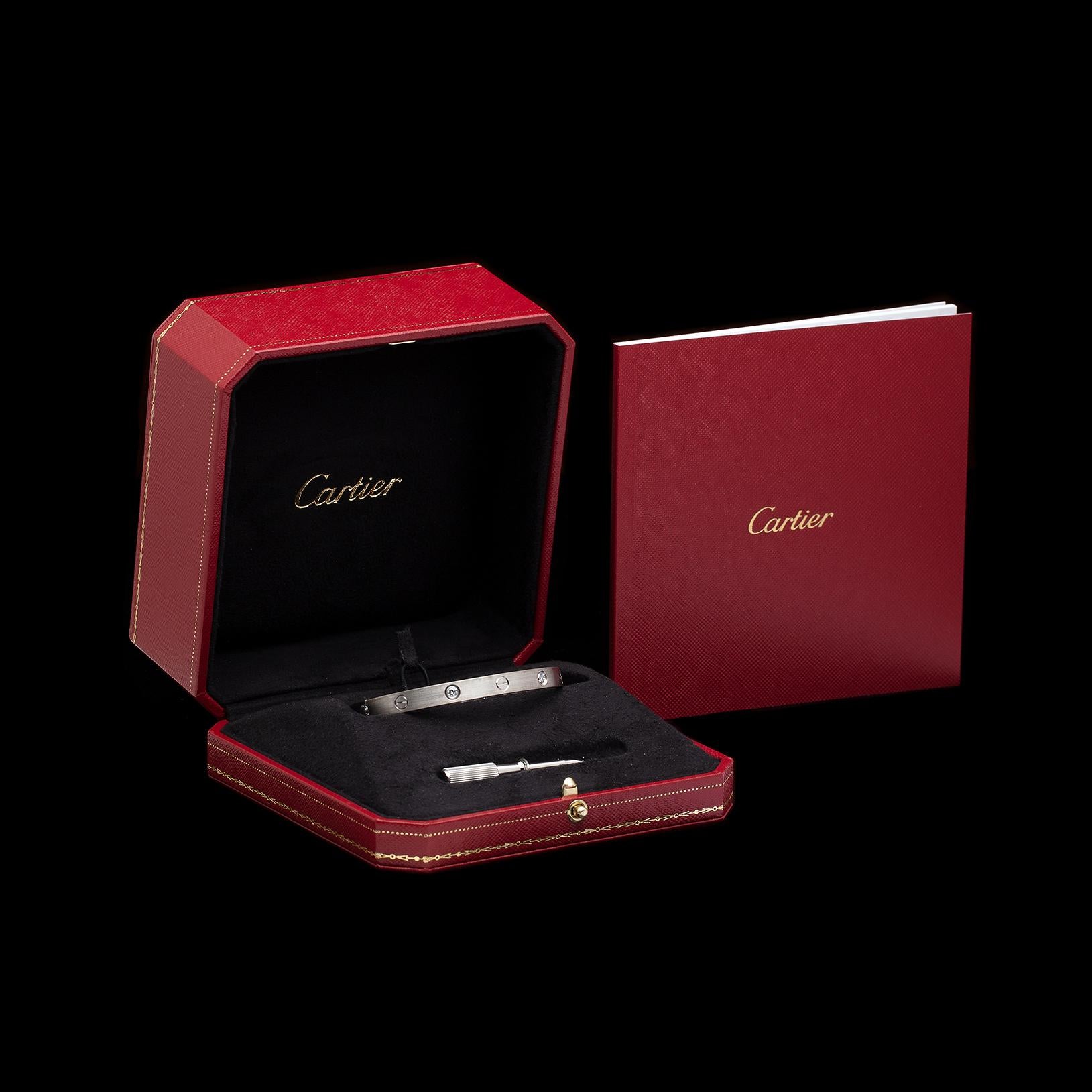 A must piece for your collection! This 18k white gold Cartier Love bracelet is set with 4 round brilliant-cut diamonds, weighing in total 0.42ct. It has a brush finish, is a Cartier size 18, fitting wrist size of approximately 6.75in. Accompanied by