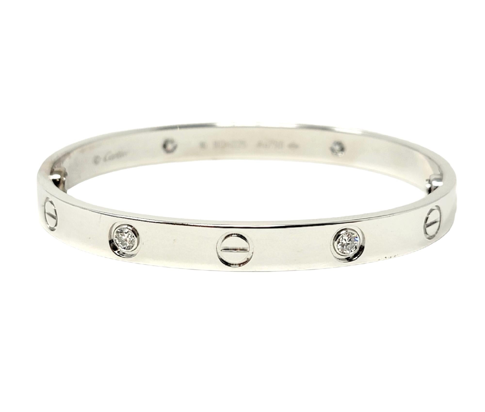Iconic Love Collection bangle bracelet with diamonds from luxury jeweler, Cartier. Includes box, outer box, and screwdriver. This simple, yet effortlessly timeless piece makes a chic statement on the wrist. With its clean lines, perfect symmetry,