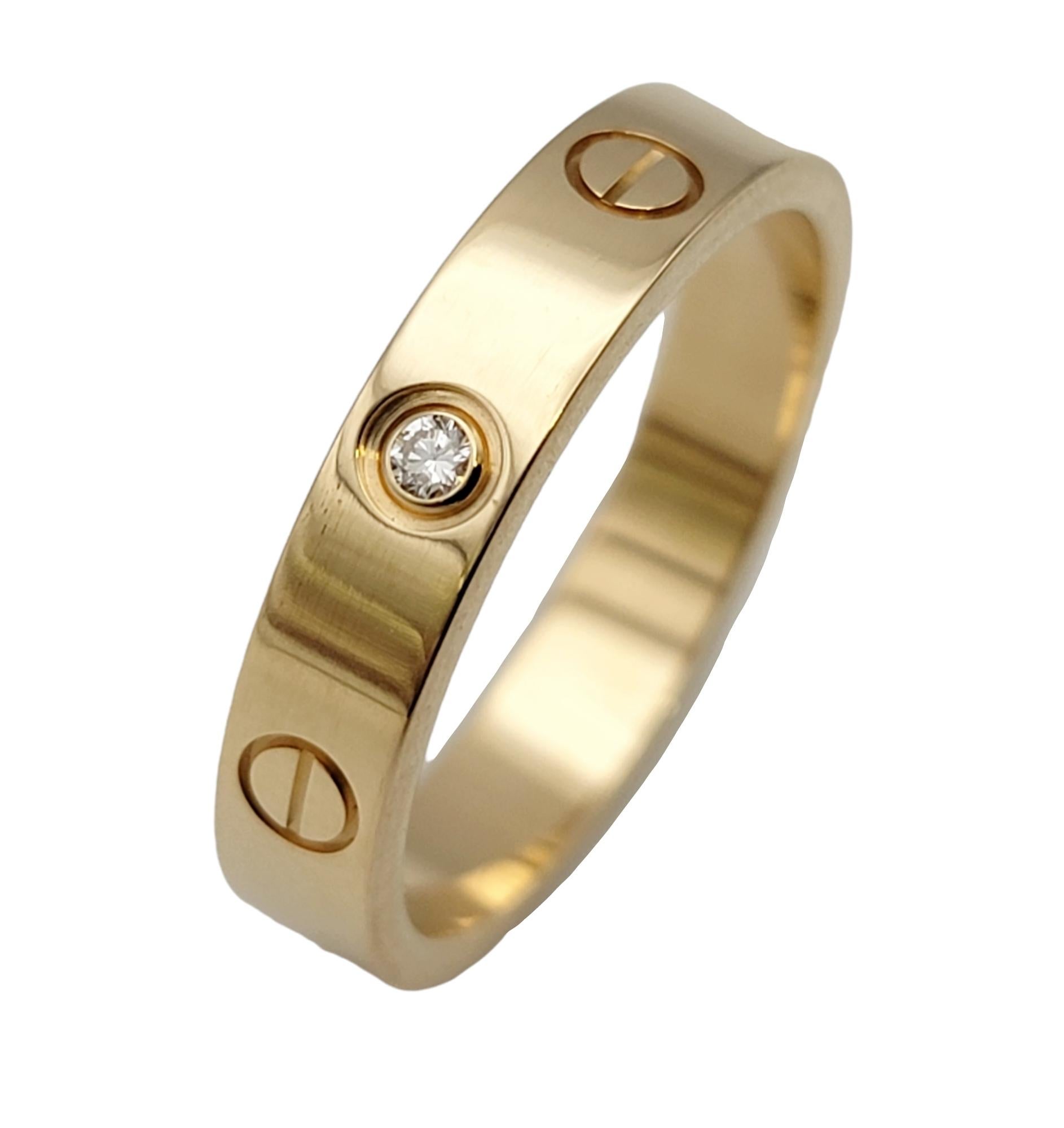 Ring size: 7.25

Iconic Love Collection 18 karat polished yellow gold band ring from luxury jeweler, Cartier. This simple, yet timeless piece makes a chic statement on the finger with its clean lines, perfect symmetry, and flawless elegance. The