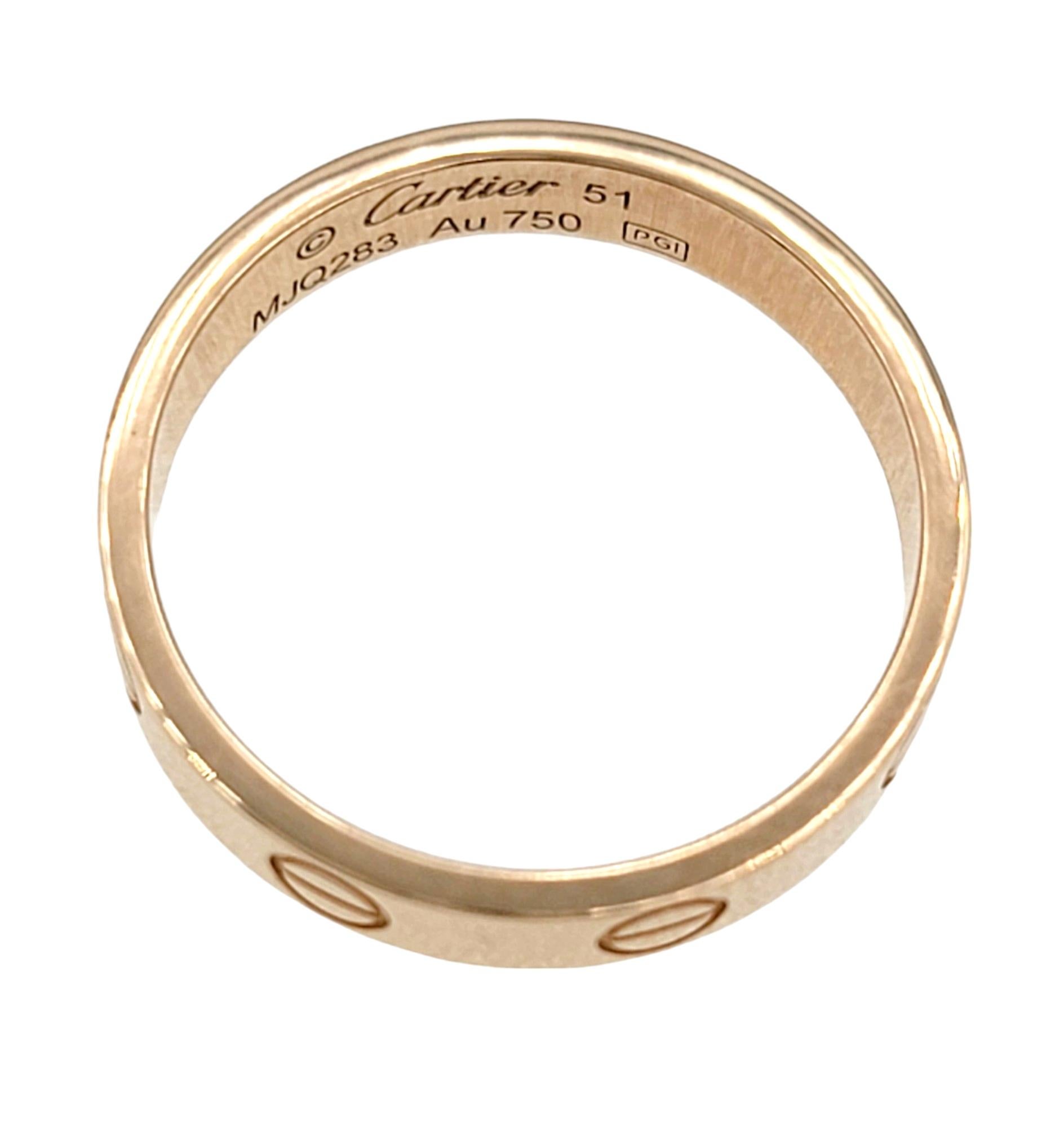 Cartier size: 51 / U.S. Ring Size: 5.75 

The Cartier Love band ring in 18 karat rose gold is a timeless and versatile piece that seamlessly transitions between casual and formal occasions. The distinctive design of the Love collection, with its
