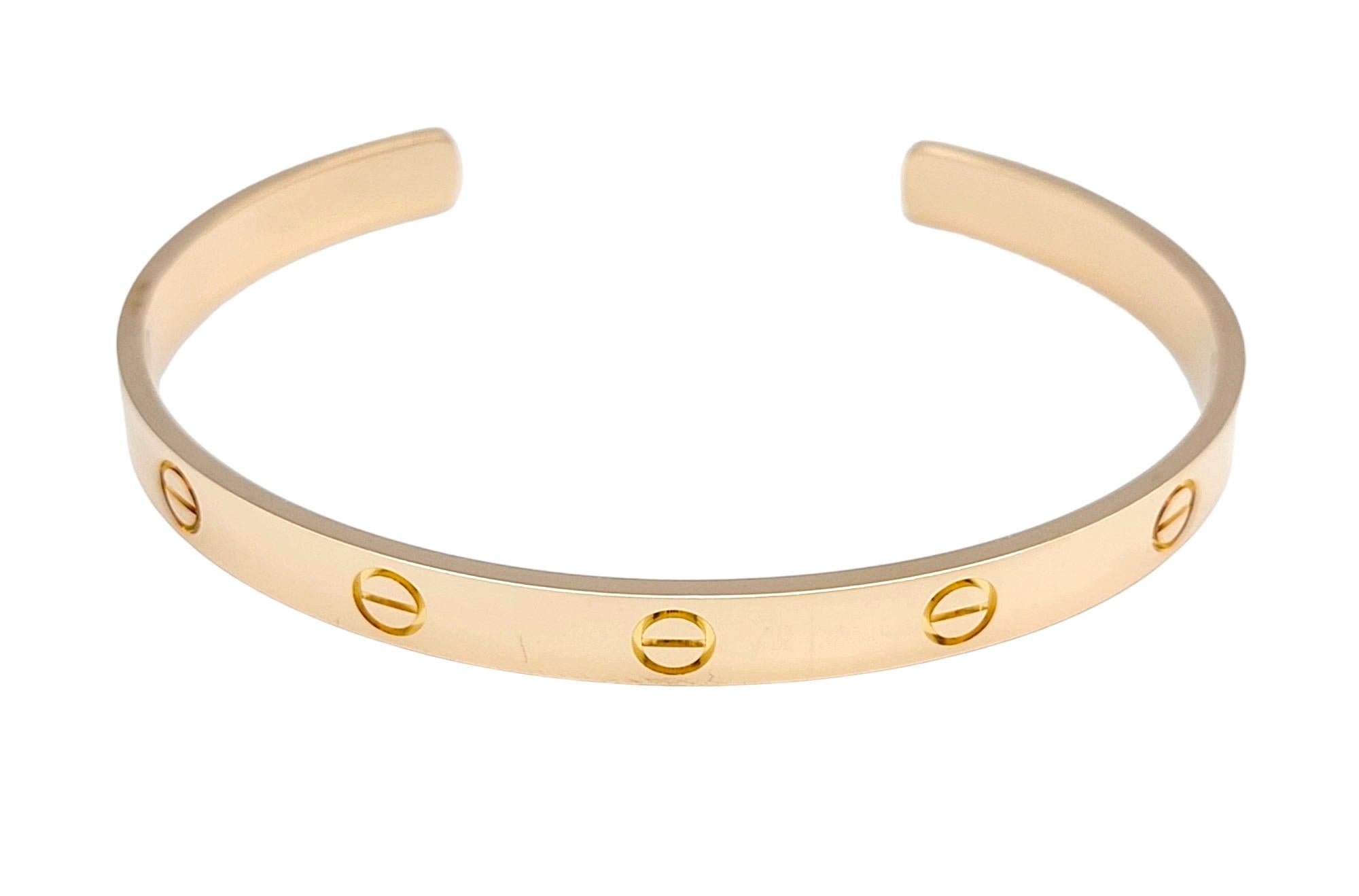The inner circumference of this bracelet measures 6.75 inches and will comfortably fit a 6.25 - 6.75 inch wrist. 

This stunning Cartier Love cuff bracelet in 18 karat rose gold is a symbol of enduring love and timeless elegance. Crafted by the