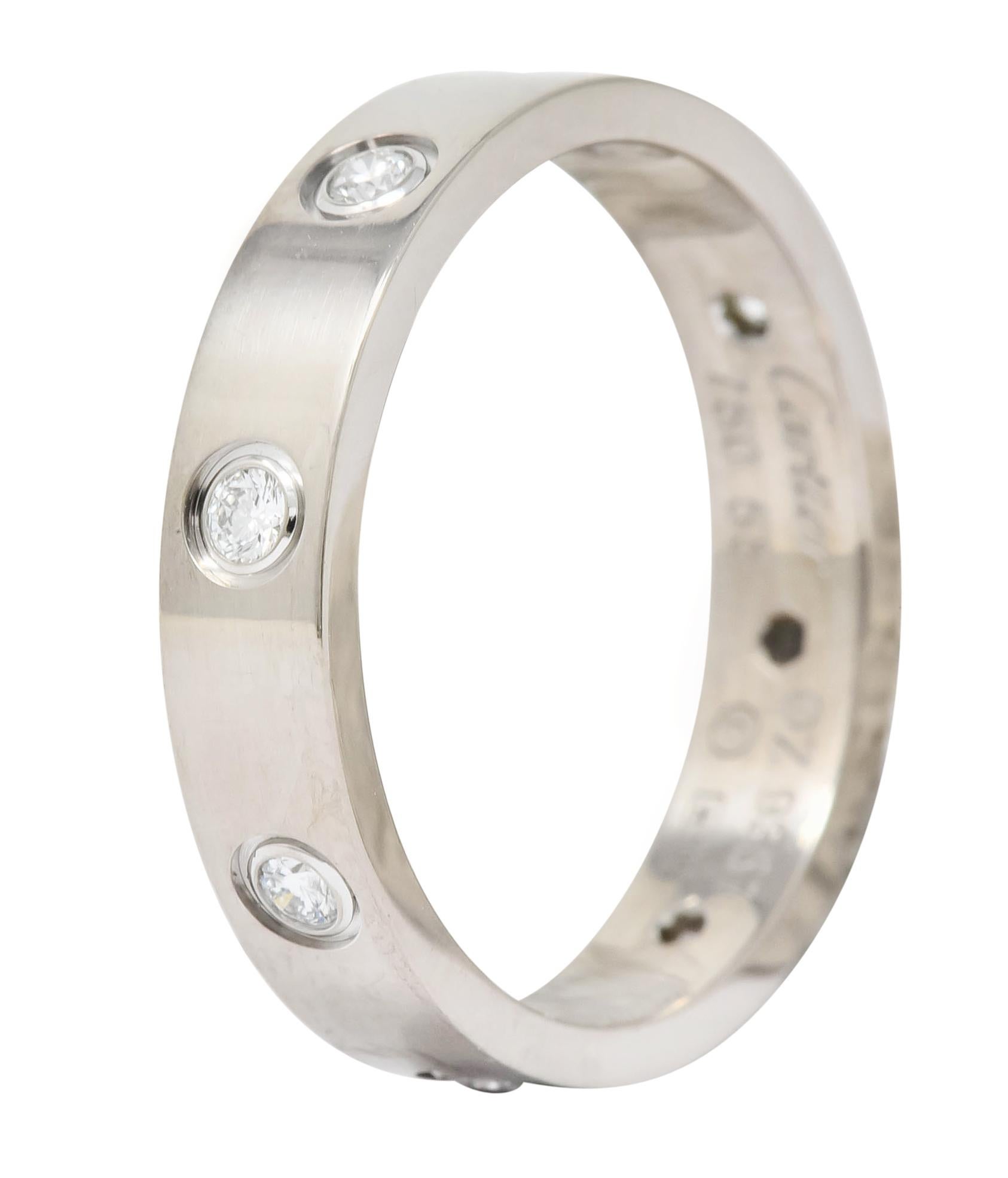 Band style ring flush set throughout with eight round brilliant cut diamonds weighing approximately 0.25 carat

Diamonds are eye-clean, white in color, and evenly spaced

From the infamous Love collection

Fully signed Cartier with Italian assay
