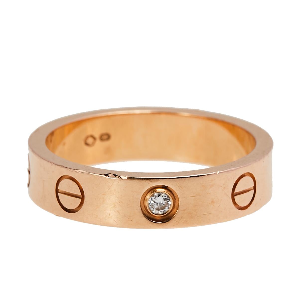One of the most iconic and loved designs from the house of Cartier, this stunning Love ring is an icon of style and luxury. Constructed in 18k rose gold, this ring features screw details all around the surface as symbols of a sealed and secured bond