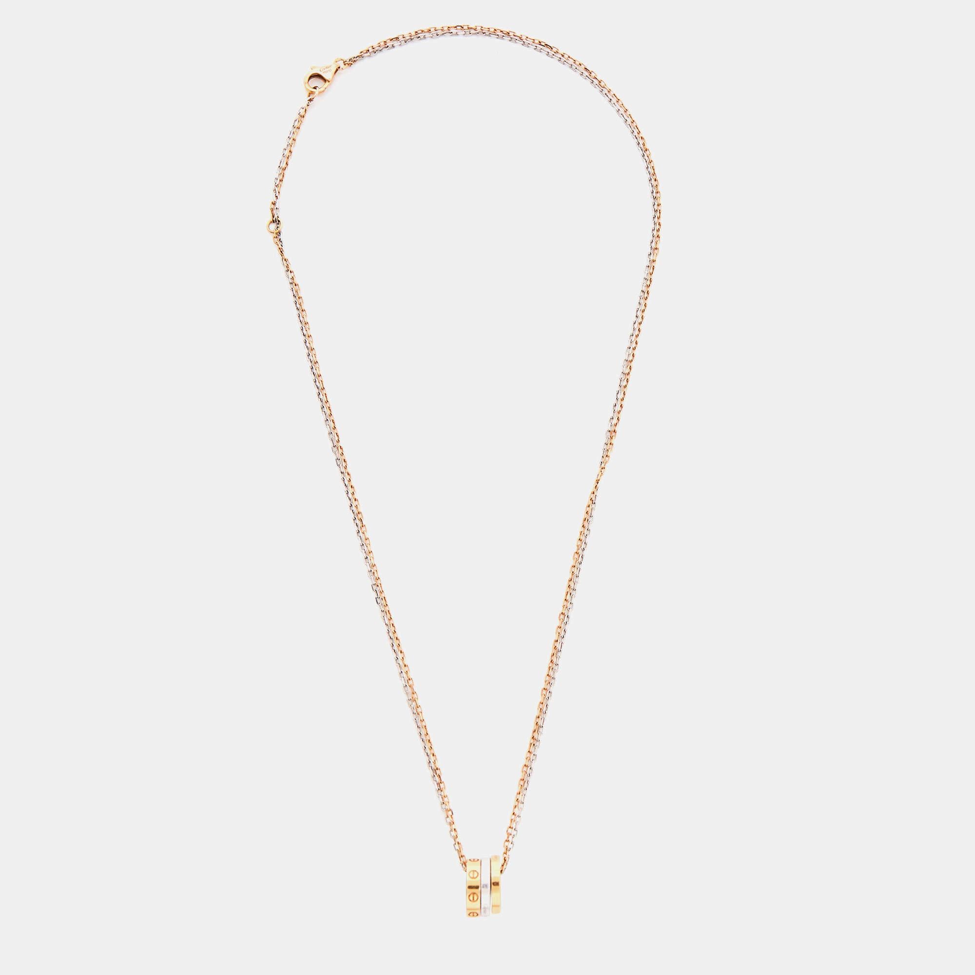 The Cartier Love necklace is a luxurious and elegant piece of jewelry. Made from 18k gold, it features a double-chain design that adds a modern touch. The necklace is adorned with sparkling diamonds, adding a dazzling and glamorous element. It is a