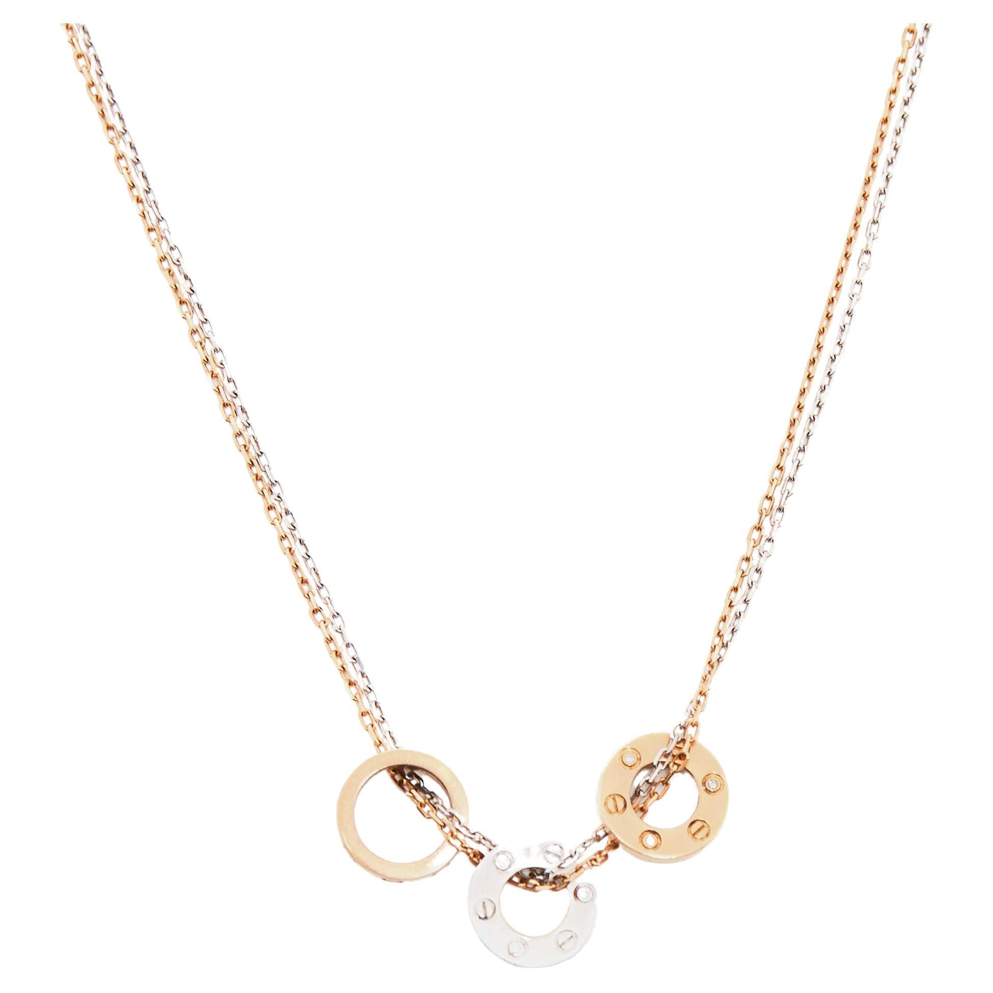 The Cartier Love necklace is a luxurious and elegant piece of jewelry. Made from 18k gold, it features a double-chain design that adds a modern touch. The necklace is adorned with sparkling diamonds, adding a dazzling and glamorous element. It is a