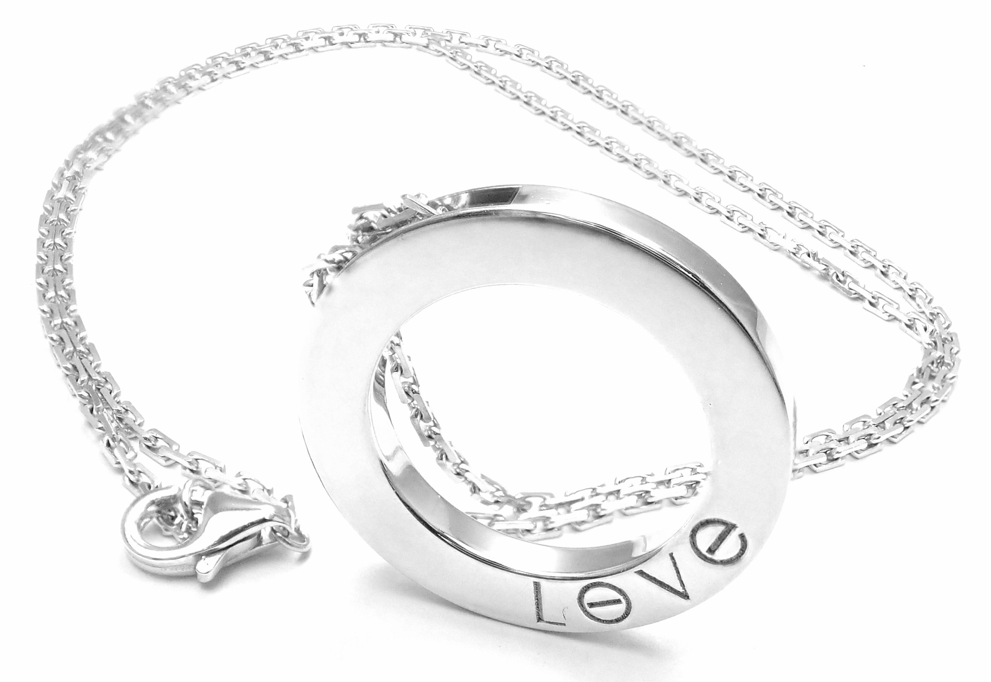18k White Gold Diamond Love Circle Pendant Necklace by Cartier. 
With 3 round brilliant cut diamonds VS1 clarity, G color total weight .07ct
This pendant comes with Cartier certificate of authenticity.
Details: 
Pendant: 24mm
Length: 16 3/4