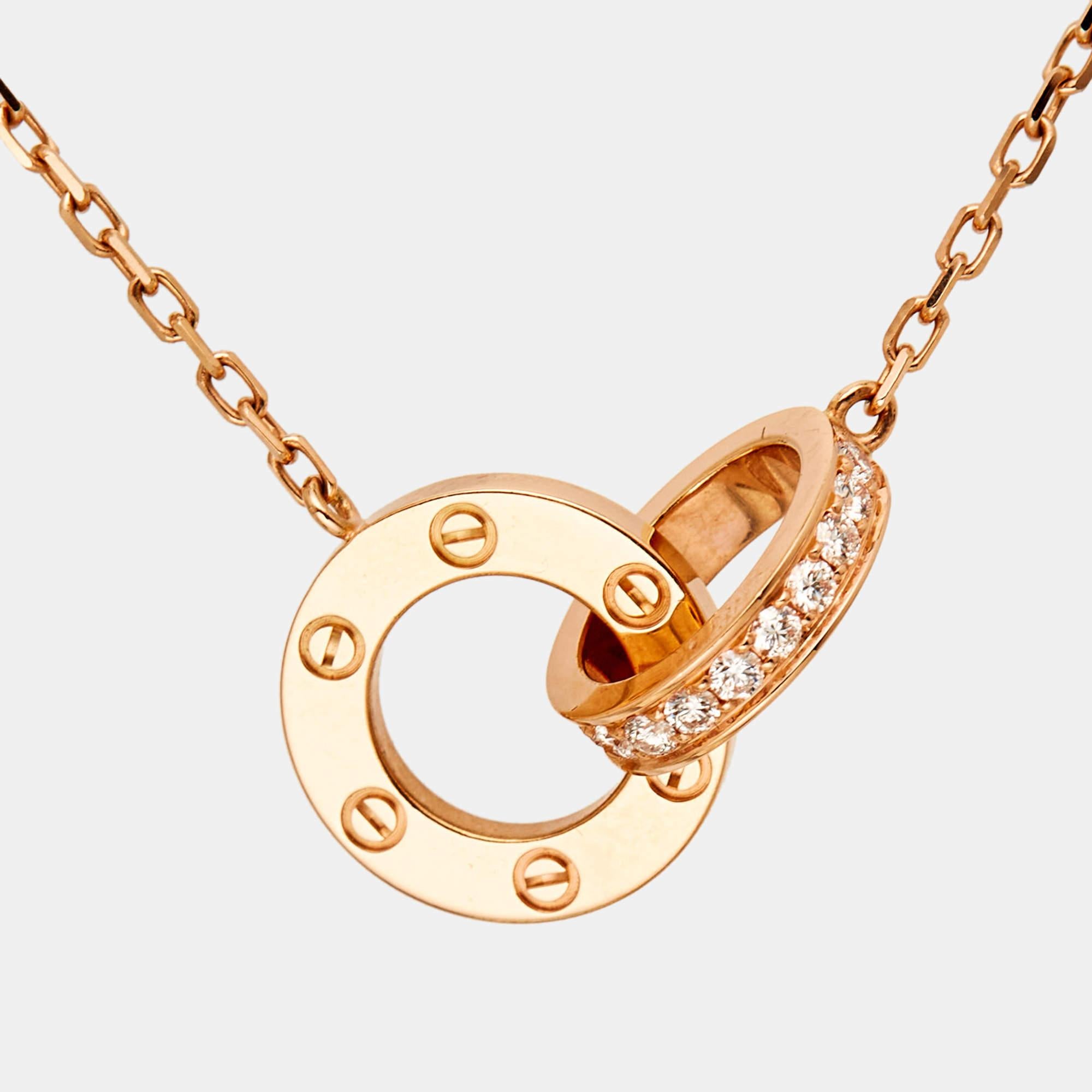 The Cartier Love necklace is an exquisite piece crafted in 18k rose gold. The design features interlocking loops adorned with dazzling diamonds, creating a luxurious and elegant aesthetic. This necklace seamlessly combines timeless style with modern