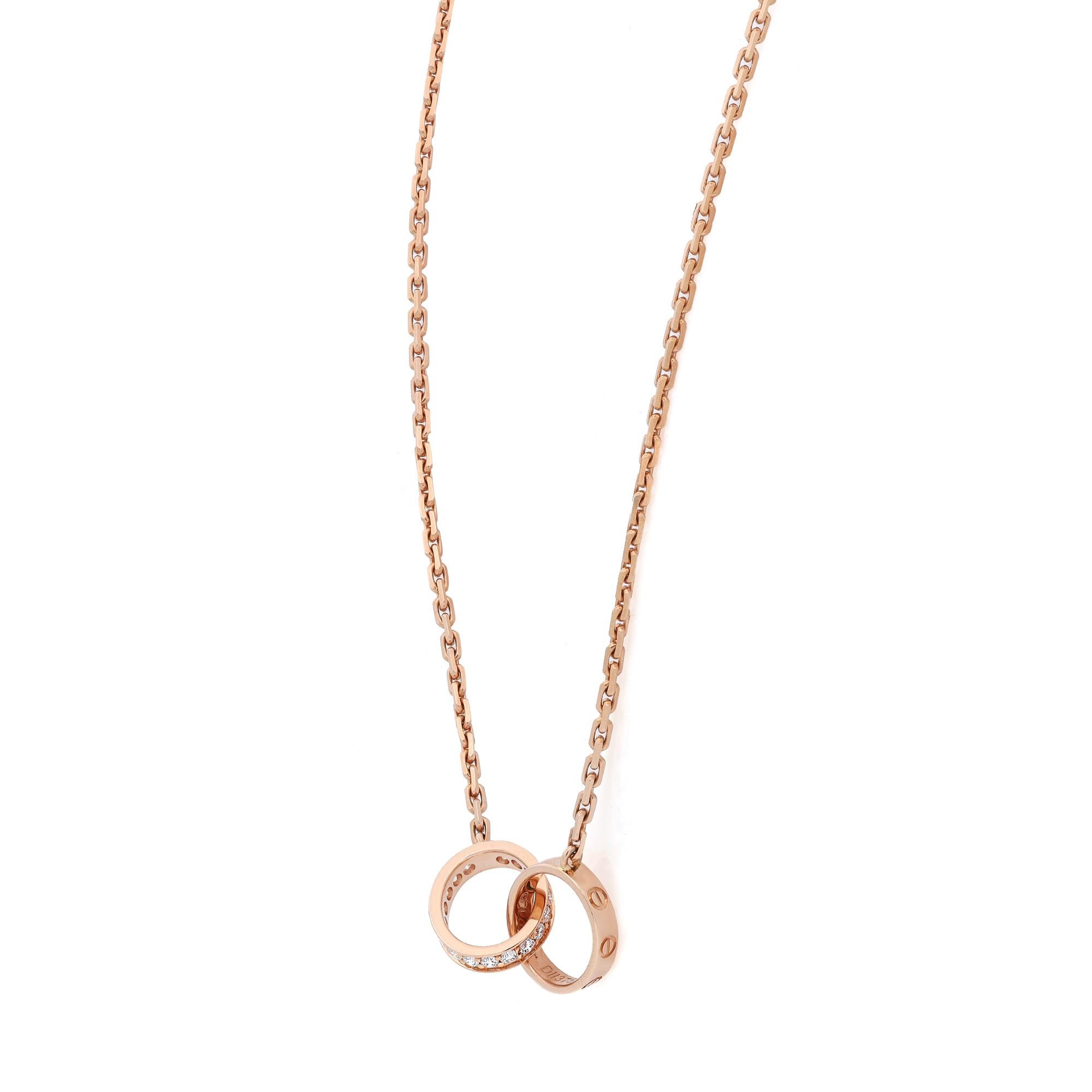 Cartier Love diamond necklace, crafted in 18K rose gold. This stunning necklace is accentuated by 18 round brilliant cut diamonds weighing 0.22 carat. Width: 2.65 mm. Inner diameter: 7.6 mm. Chain length: 16.5 inches. Total weight: 7.30 grams.