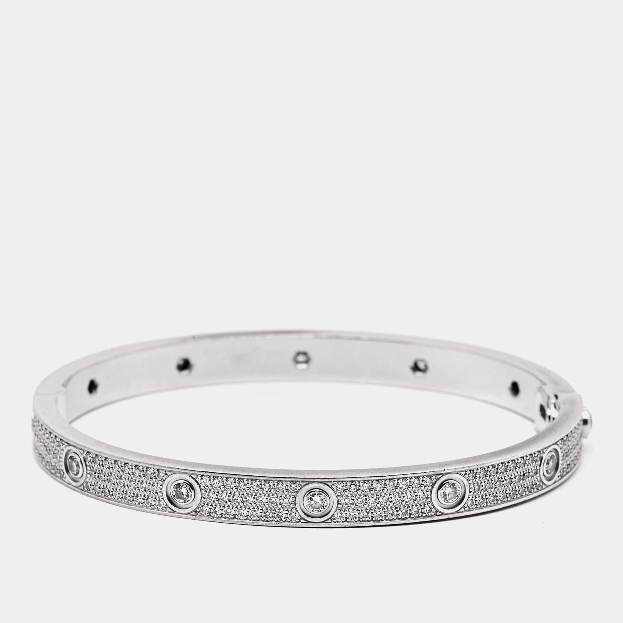The Cartier bracelet is a luxurious masterpiece, crafted with exquisite precision. Set in gleaming 18k white gold, it features a stunning pavé of diamonds, adding timeless elegance to the iconic Love bracelet design, creating a symbol of enduring