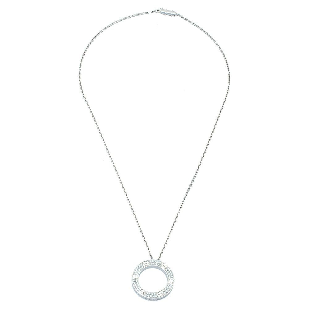 Celebrate timeless love with this necklace from Cartier's LOVE collection that has become a modern symbol of luxury and a way to lock in one's love. It is made from 18K white gold featuring a slender chain that holds a single ring pendant decorated
