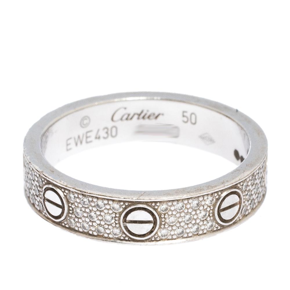 One of the most iconic and loved designs from the house of Cartier, the stunning Love ring is an icon of style and luxury. This is an updated version that arrives in 18k white gold decorated beautifully with pave set diamonds all over. The ring also