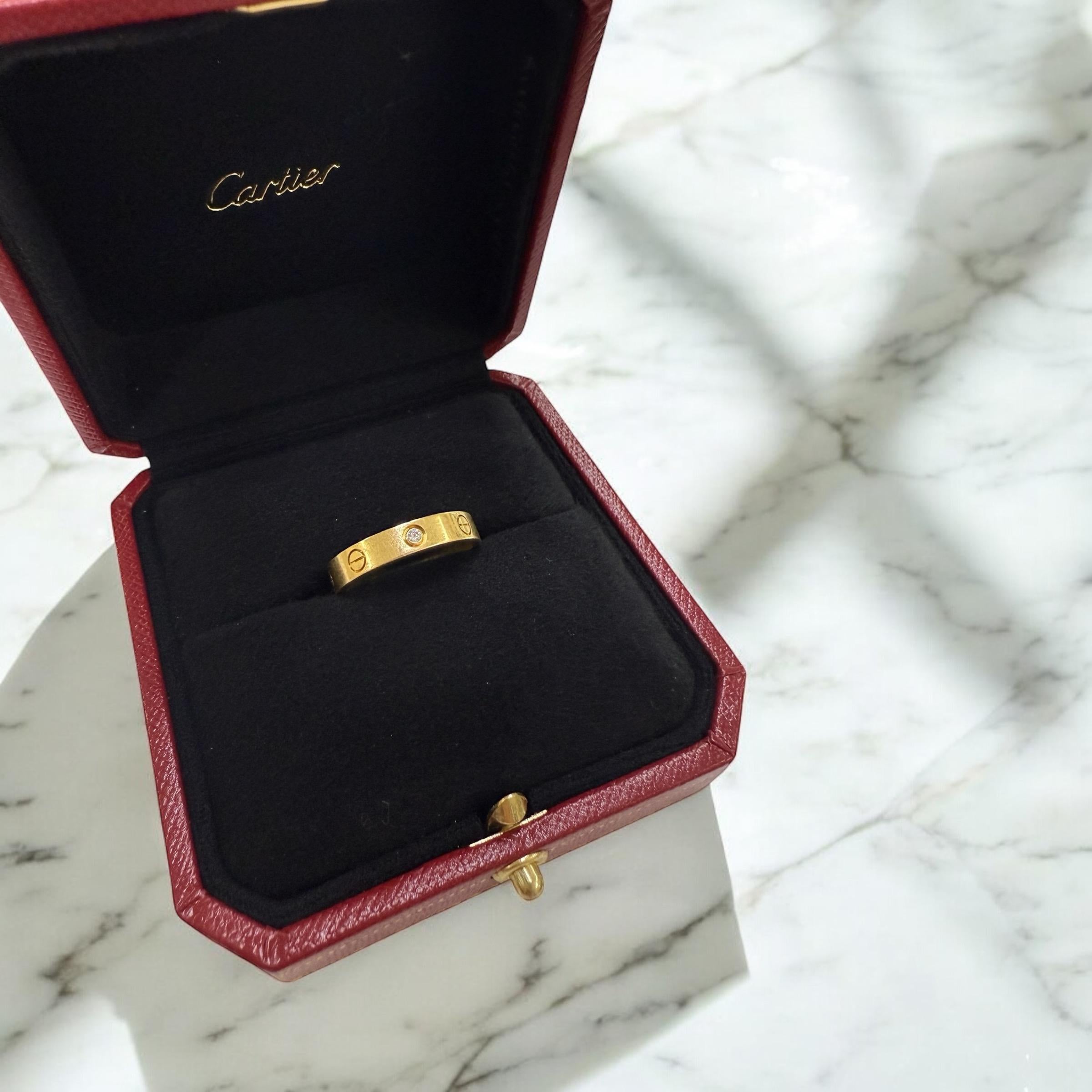 Cartier is known for their classic LOVE design, bangles & rings.
This little beauty makes a statement!

Ring Details
Material: 18K Yellow Gold; Stamped 750
Designer: Cartier
Band Width: 4mm
Weight: 5.1 Grams
Cartier Reference Number: B4050700
Finger
