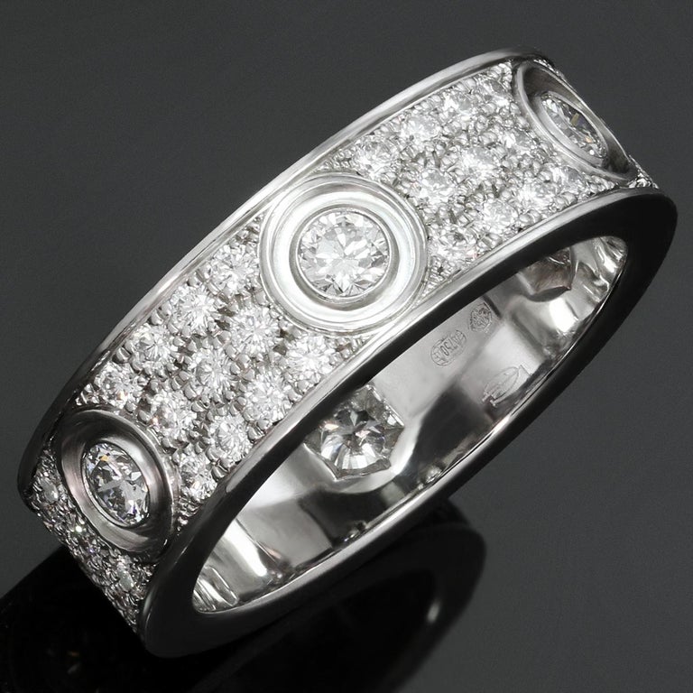 This spectacular band ring from Cartier's iconic Love collection is crafted in 18k white gold and set with brilliant-cut round D-F VVS1-VVS2 diamonds of an estimated 1.30 carats. A romantic and timeless design. Made in France circa 2007.