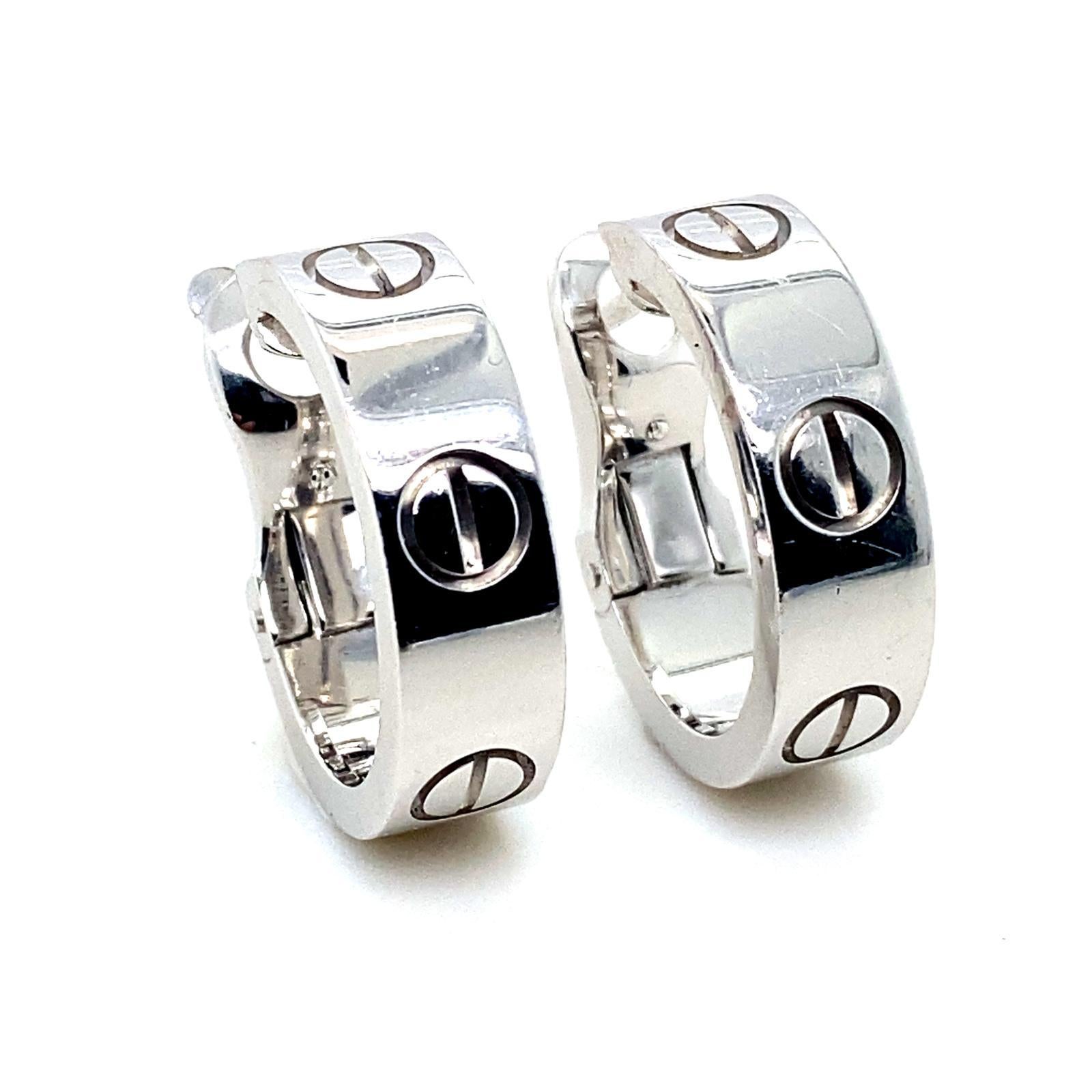 A pair of Cartier Love earrings in 18 karat white gold.

These classic Cartier earrings feature the iconic Love Design, with a polished finish crafted in 18 karat white gold with post and clip fittings.

Signed 
