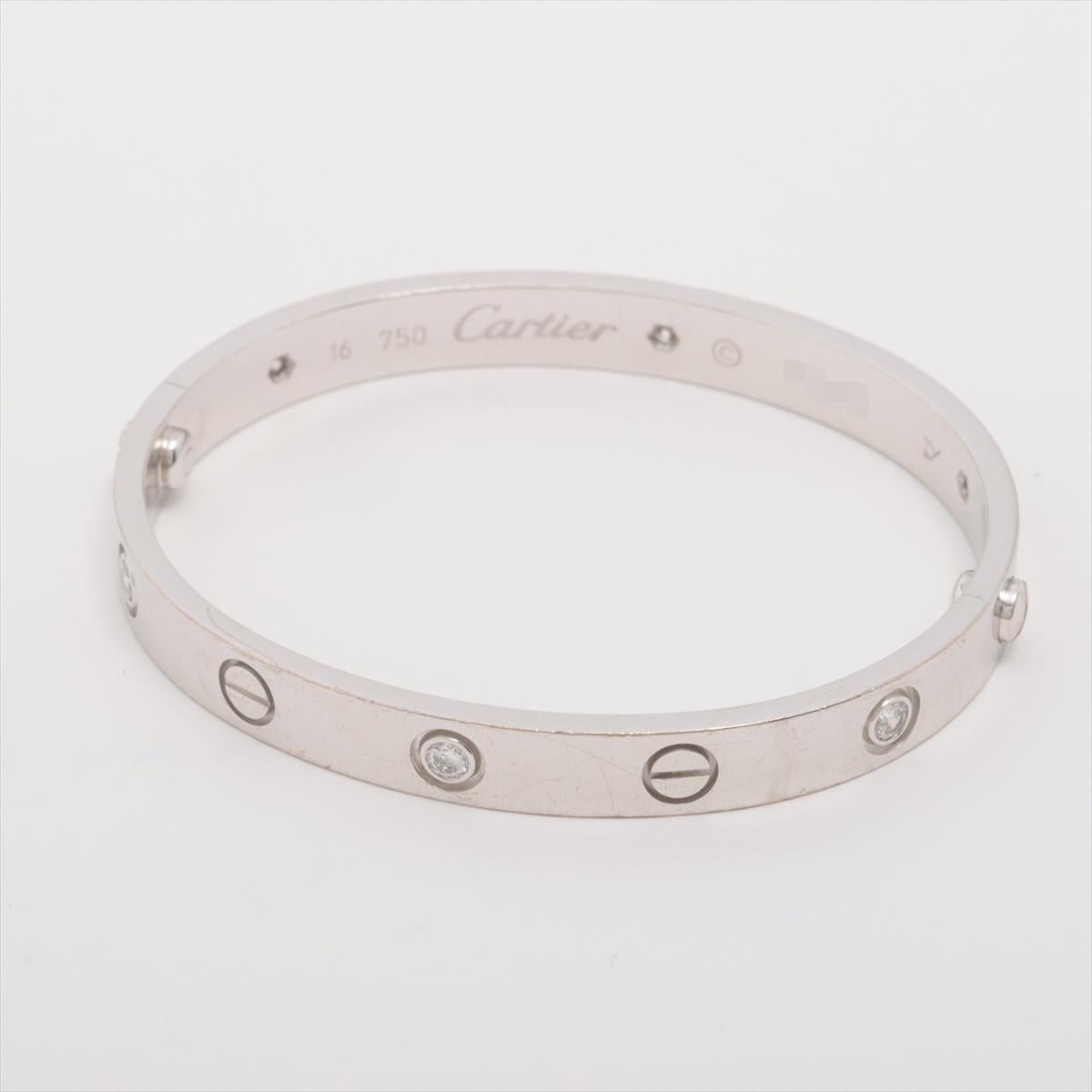 Cartier Love Half Diamond Bracelet
750(WG) 
31.8g 
Size 16
Full Set with Screwdriver

The Cartier Love Bracelet in white gold with diamonds is a timeless symbol of love and commitment. Featuring Cartier's signature screw motif and set with diamonds,