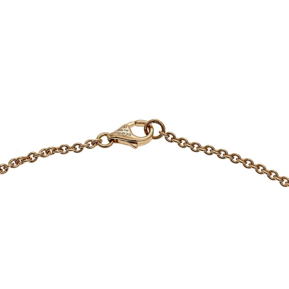 Celebrate timeless love with this necklace from Cartier's Love collection. It is made from 18k rose gold and the chain holds two magnificent hoops interlocked with one another. Both the rings carry the iconic screw motifs which are a signature of