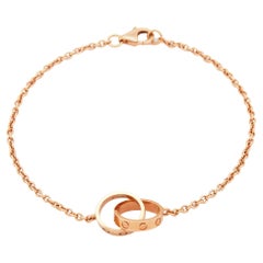 Bracciale Cartier Love con anelli intrecciati in oro rosa 18 carati