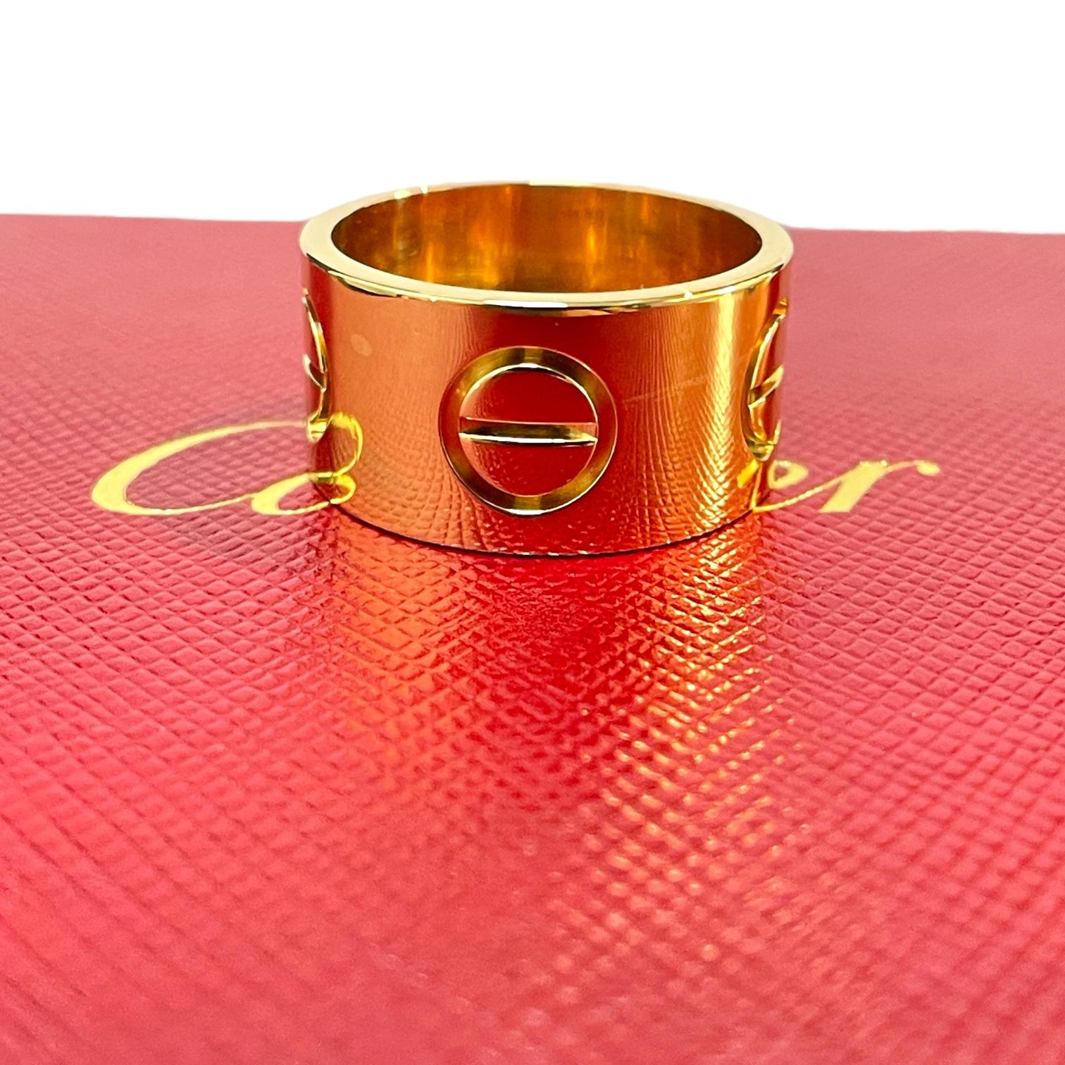 Embrace the essence of timeless elegance with the Cartier LOVE Ring in 18k Yellow Gold, a stunning piece that transcends generations and trends. This large model, with a width of 11 mm and a thickness of 1.3 mm (for size US 8), showcases the iconic
