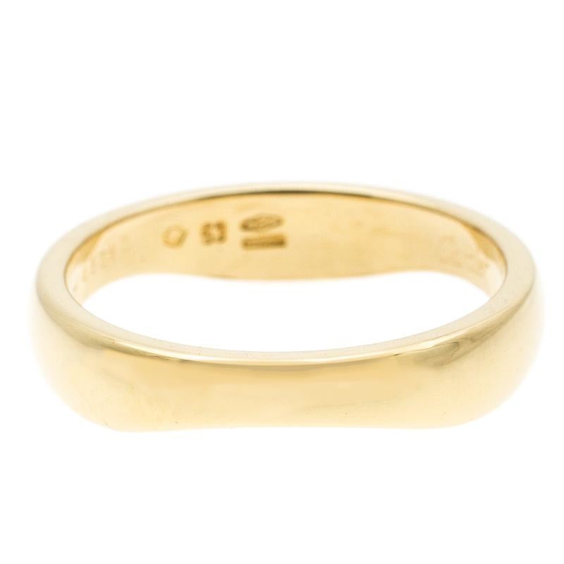This 'Love Me' ring from Cartier is that versatile piece of jewelry that you would want to wear every day. It features an 18k yellow gold body that can be stacked and worn or used as an individual piece. We love the simplicity and elegance of this