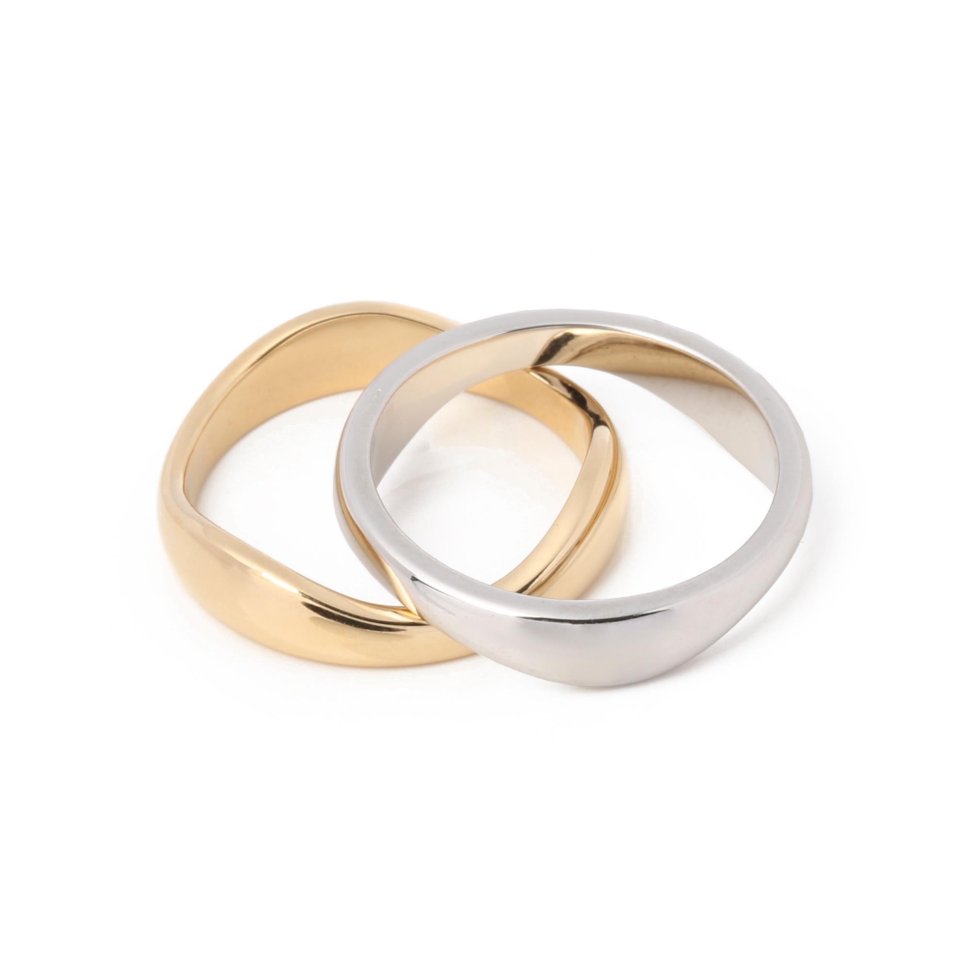 These rings by Cartier feature an undulating design that allows the bands to fit together, symbolising the 'love me' collection. UK ring size L. EU ring size 52. US ring size 6 1/2. Accompanied with a Xupes presentation box. Our Xupes reference is