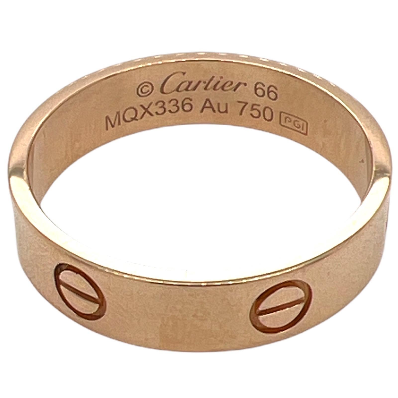 Cartier's iconic LOVE ring fashioned in 18 karat rose gold. The band measures 5.5mm in width and is size 66 (US size 11.5). The band includes original papers. 