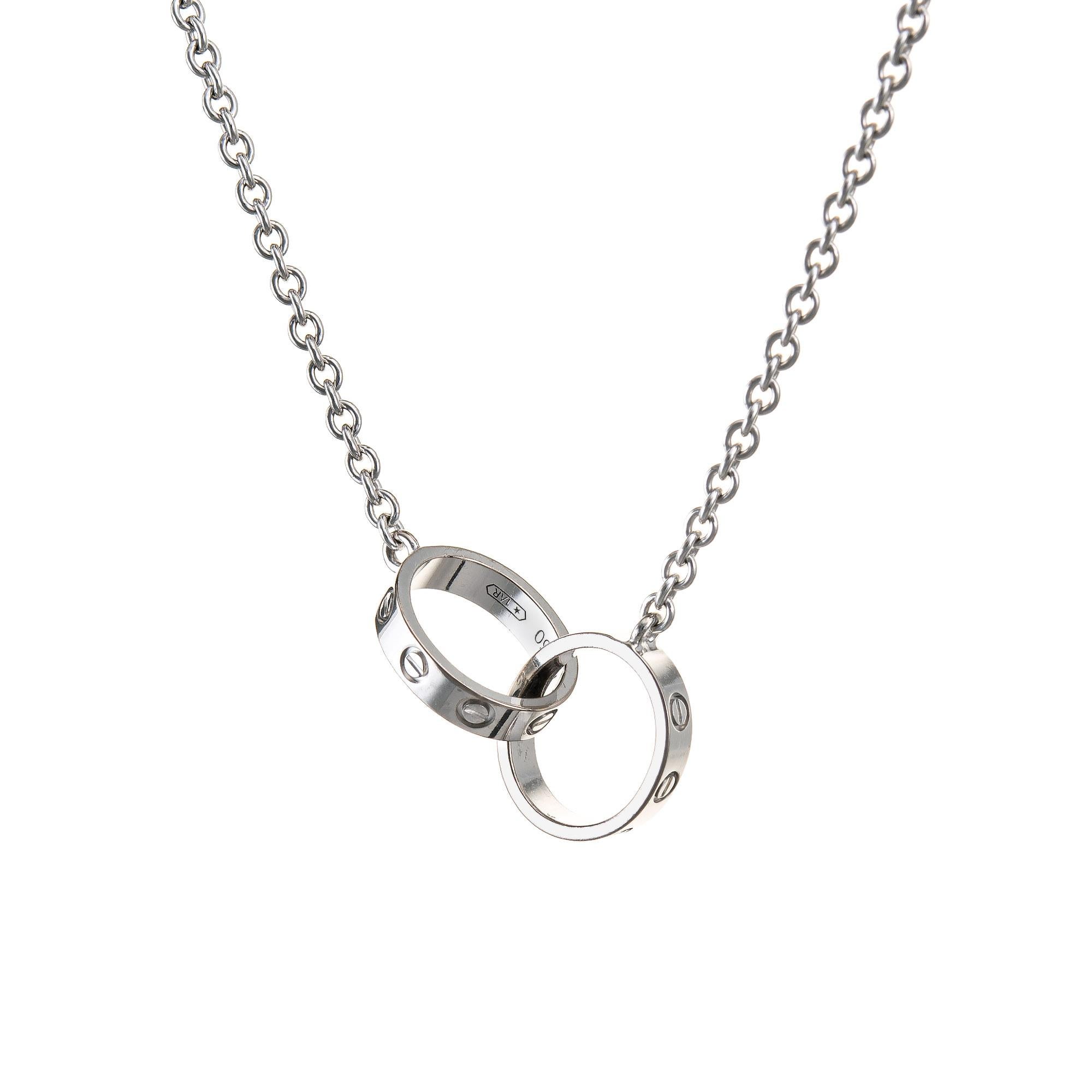 Pre-owned Cartier Love necklace crafted in 18k white gold.  

The Cartier necklace features two interlocking love links. The necklace is great worn alone or layered with your fine jewelry from any era. 

The ring is in very good condition and was