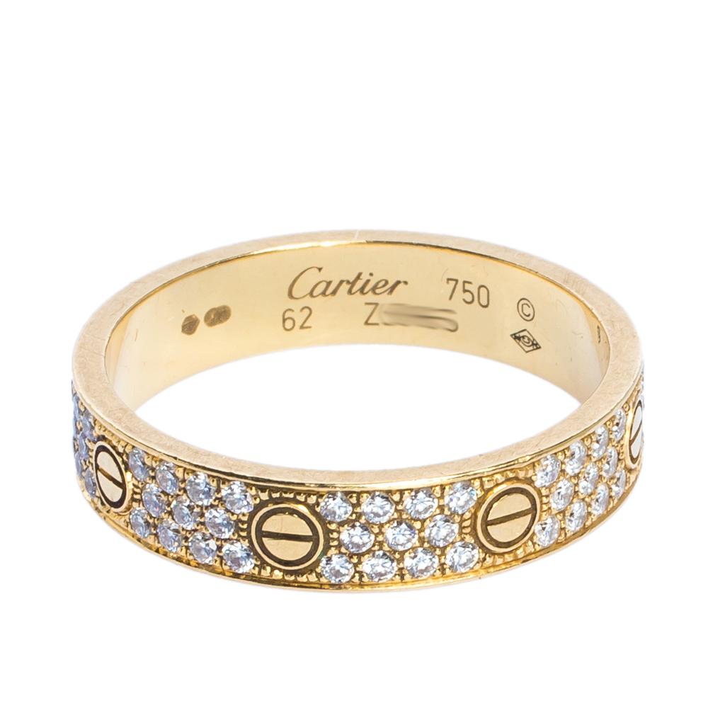 For a love that is special, only the most precious of rings will do. We have here a worthy creation from the iconic Cartier Love collection. The ring is sculpted in 18k yellow gold and joining the famous screw motifs are carefully-set diamonds that