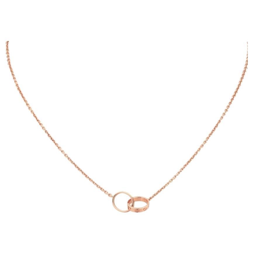 Cartier Love Pendant Necklace, Rose Gold.

Symbol of eternal love, the bracelet, once attached, cannot be removed.
LOVE necklace, 750/1000 pink gold. Inside diameter 8mm. Chain length 440mm.
6.7 grams.
Numbered RR7999 and signed Cartier.

Do not