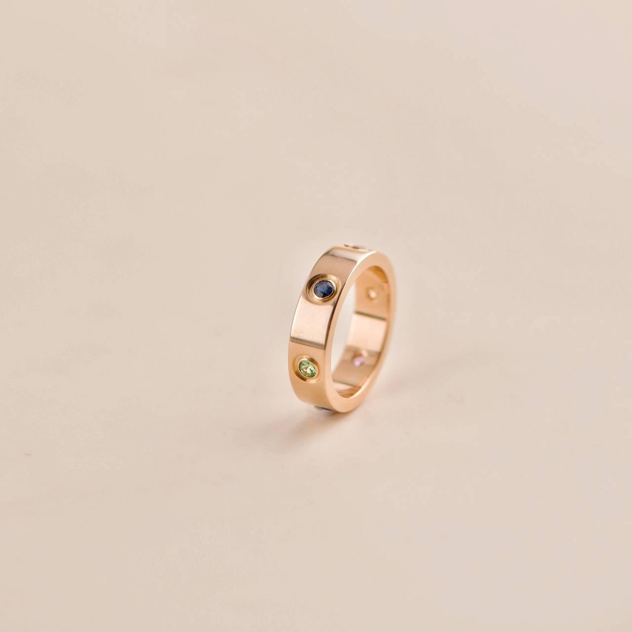 SKU	AT-2460
Comes With	Pouch Only
Date	2013
Model	B4087855
Serial Number	YO****
Metal	18k Rose Gold
Stones	Sapphire, Pink Sapphire, Amethyst, Yellow Sapphire, Green Garnet, Orange Garnet
Weight	9.1 g
Ring Size	55 
Condition	Excellent
Other Info	Size