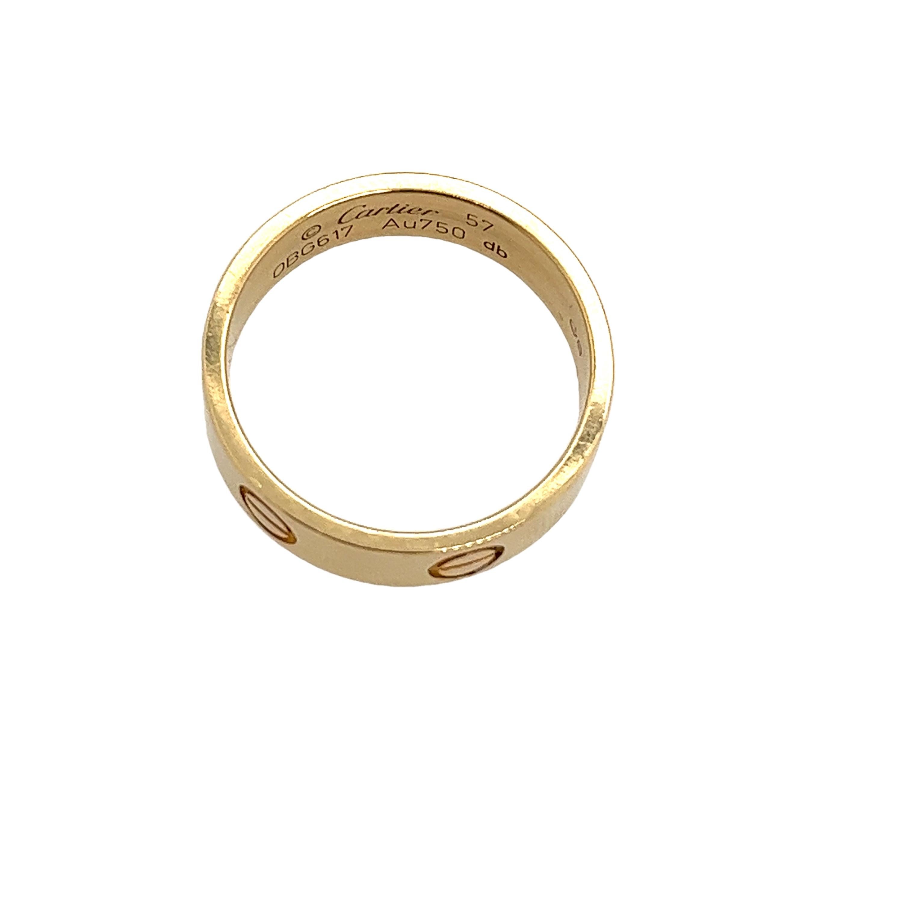 This iconic Cartier LOVE Ring, crafted in 18ct Yellow Gold, 
is a timeless symbol of commitment and elegance. 
With a 5.5mm width and a size 57 fit, 
the ring showcases Cartier's renowned craftsmanship 
and minimalist design. 
A true classic, the