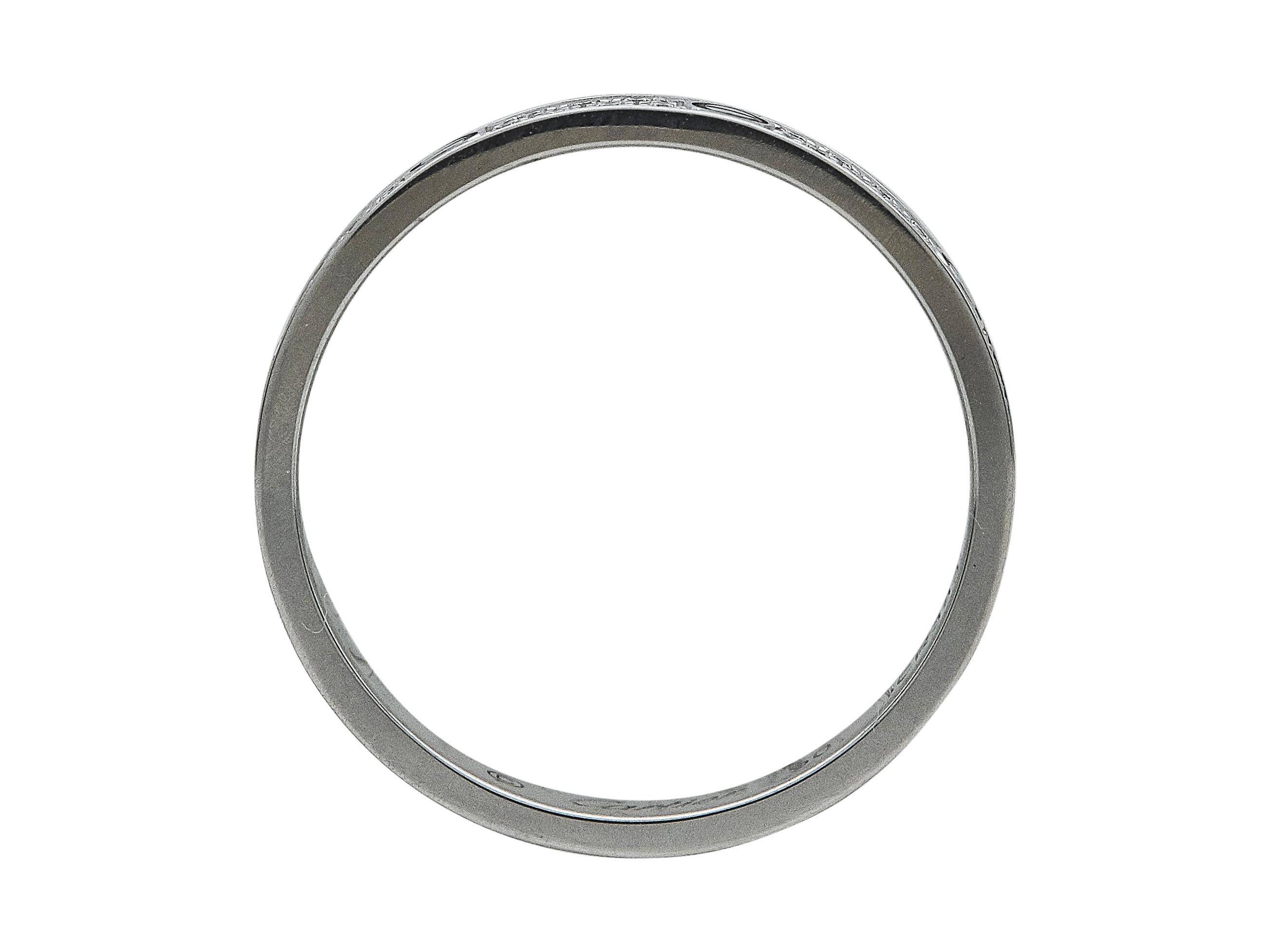 The ring: A Cartier Love ring. This Mini model is designed in eighteen karat white gold with round brilliant cut diamond  pavé. It is a size 50.

The ring is in excellent condition, with only a few minor scratches that are expected with normal wear.