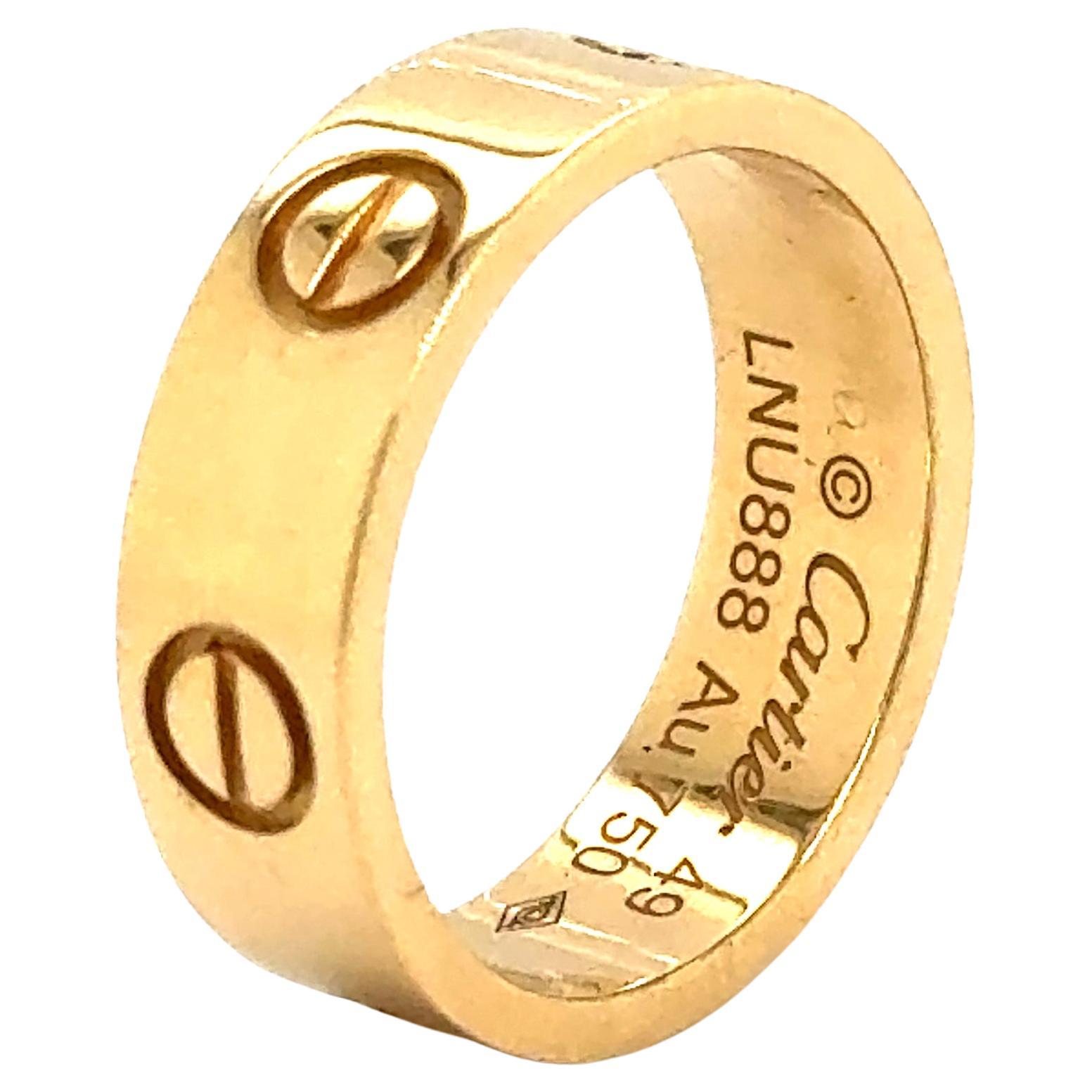 Cartier Love ring in 18K yellow gold. The ring is a size 49 U.S. size 4 3/4 with serial LNU---. Ring is fully hallmarked by designer 